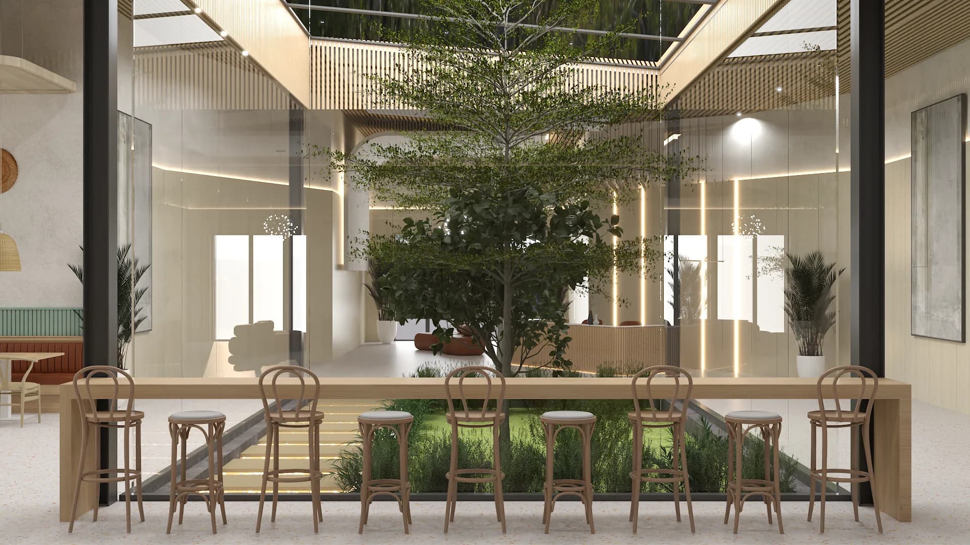 Oak bar counter with bentwood stools facing glass atrium wall and canopy tree behind