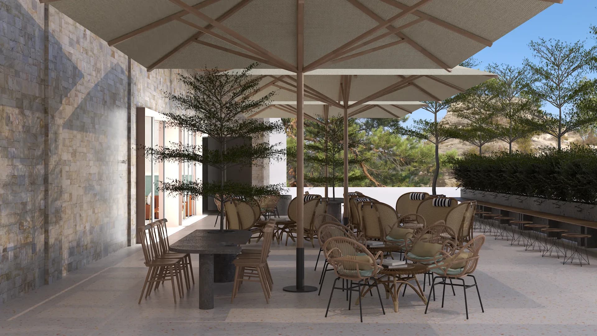 Side angle of outdoor terrace with concrete dining table, wood chairs, and rattan lounge seating