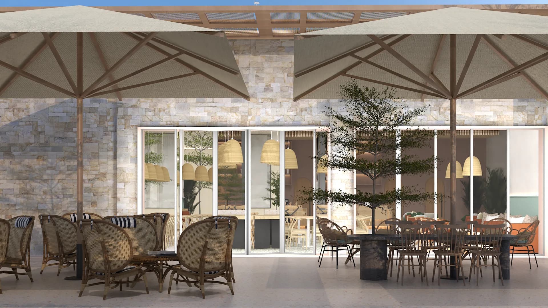 Terrace facing stone and glass building facade with umbrella zones and interior pendants visible