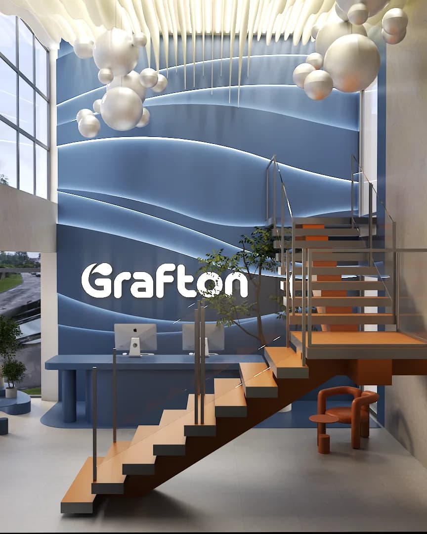 3D wave acoustic wall with backlit signage and a floating orange staircase beside.