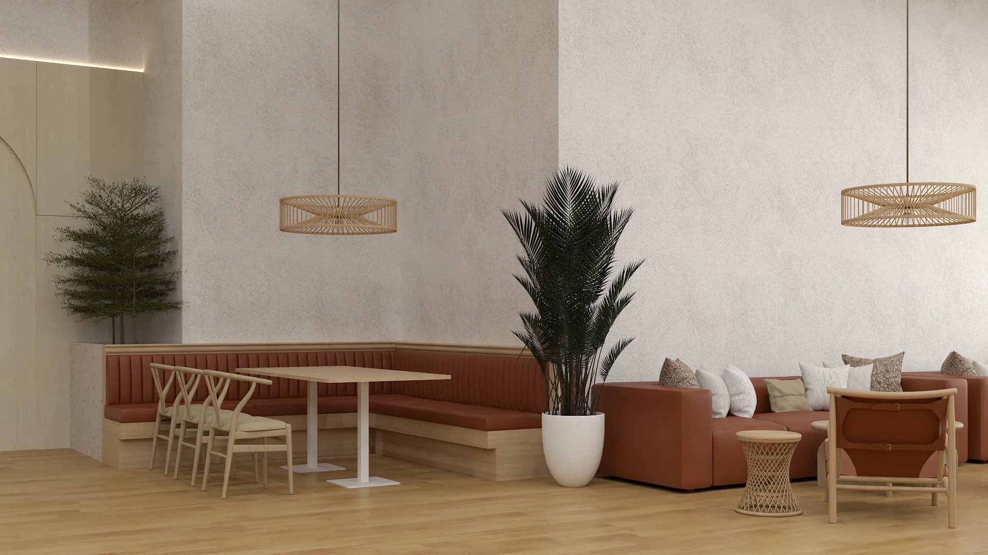 L-shaped cognac banquette with wishbone chairs and rattan pendants in employee dining