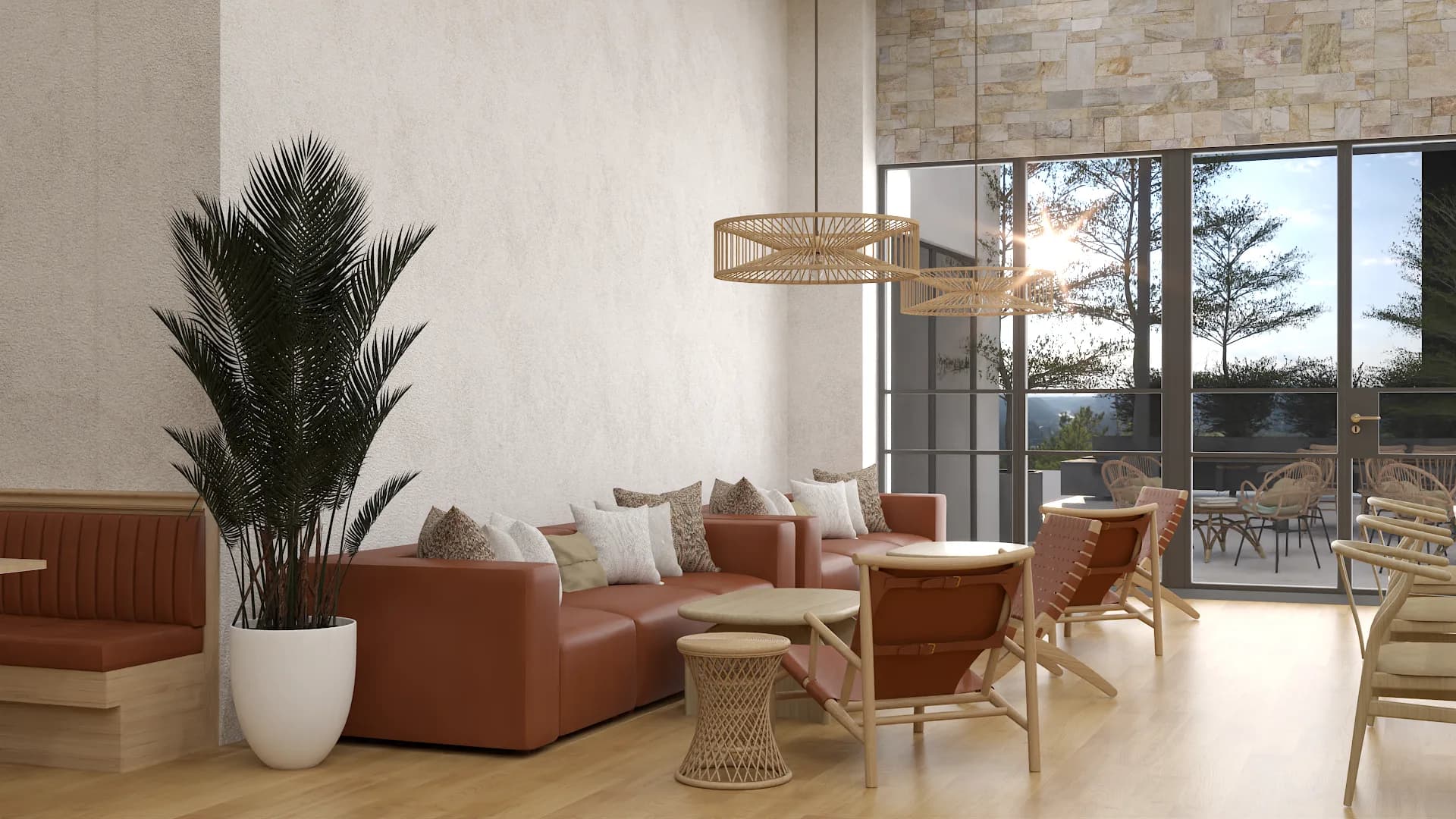Corporate lounge corner with cognac leather sofa, rattan chairs, and woven side table