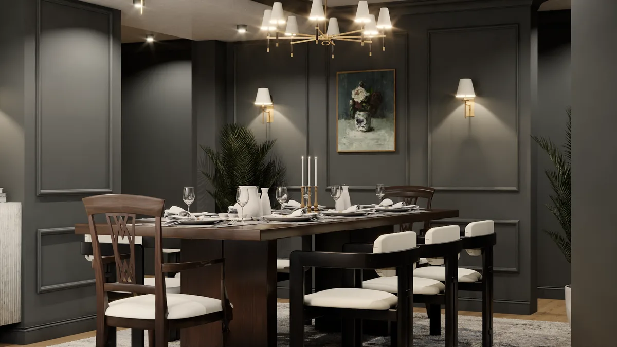 Angled view of charcoal paneled dining room with set table, brass chandelier, and floral painting