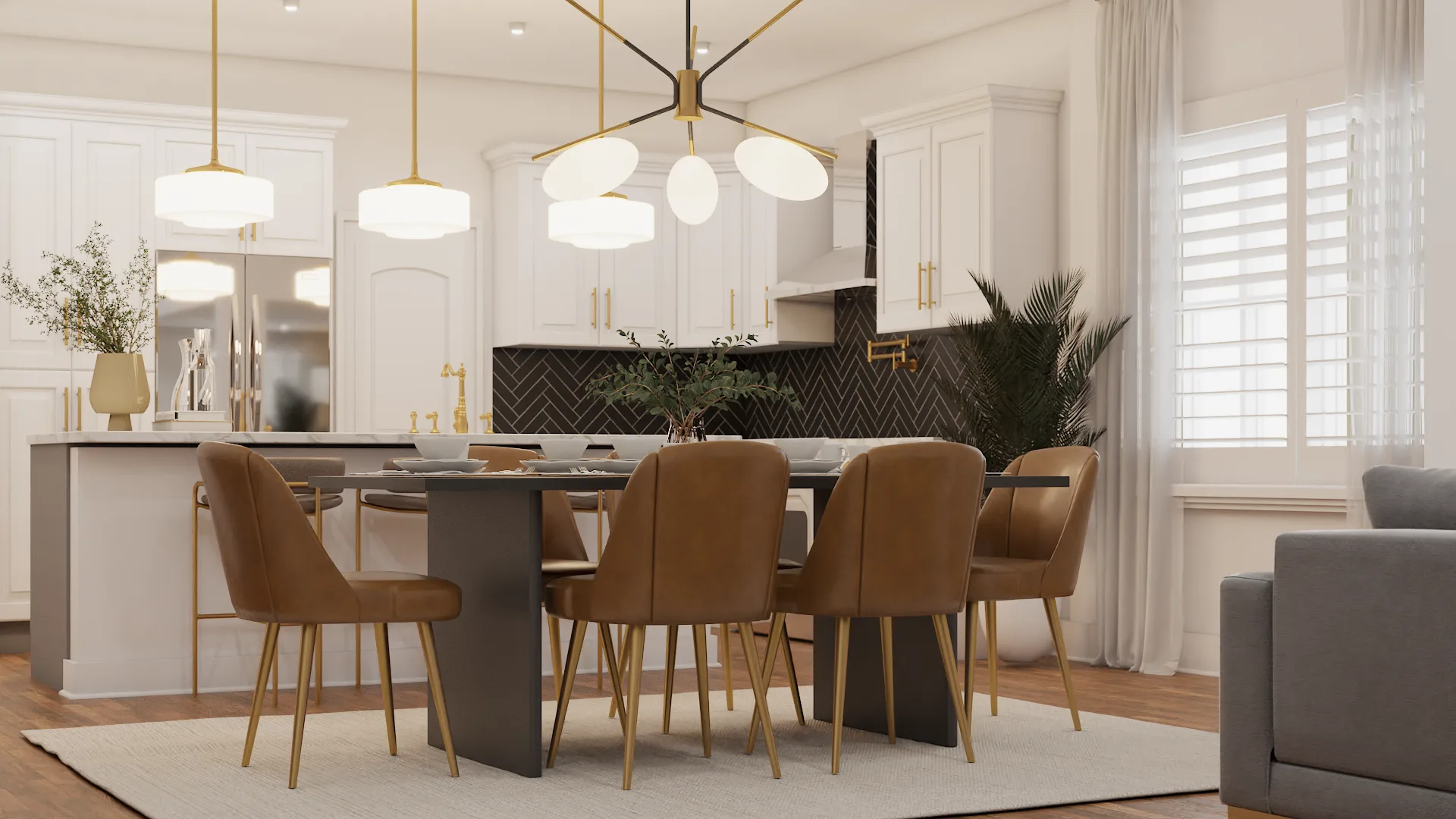 Open-plan dining room with dark slate table, cognac leather chairs, brass sputnik chandelier, and white shaker kitchen