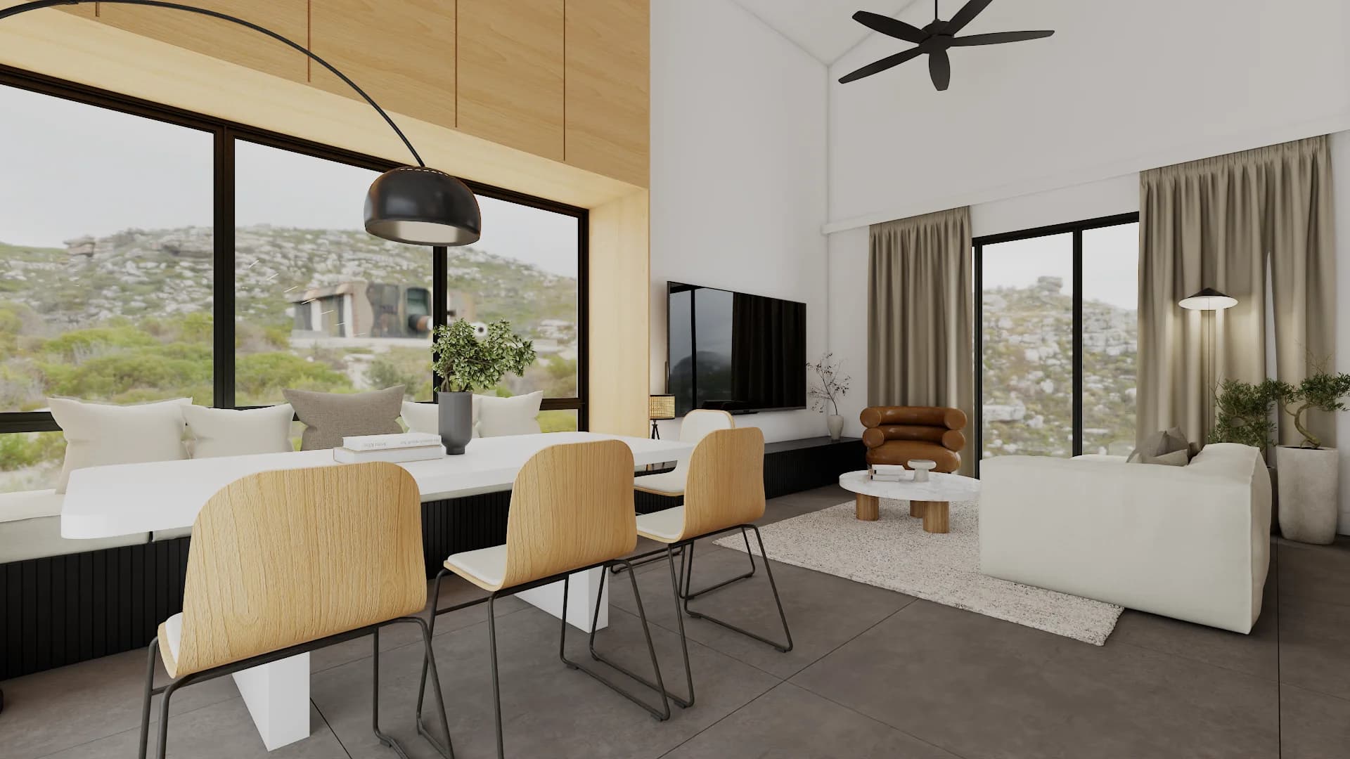 Scandinavian open-plan dining with light wood chairs, arc lamp, and mountain views.