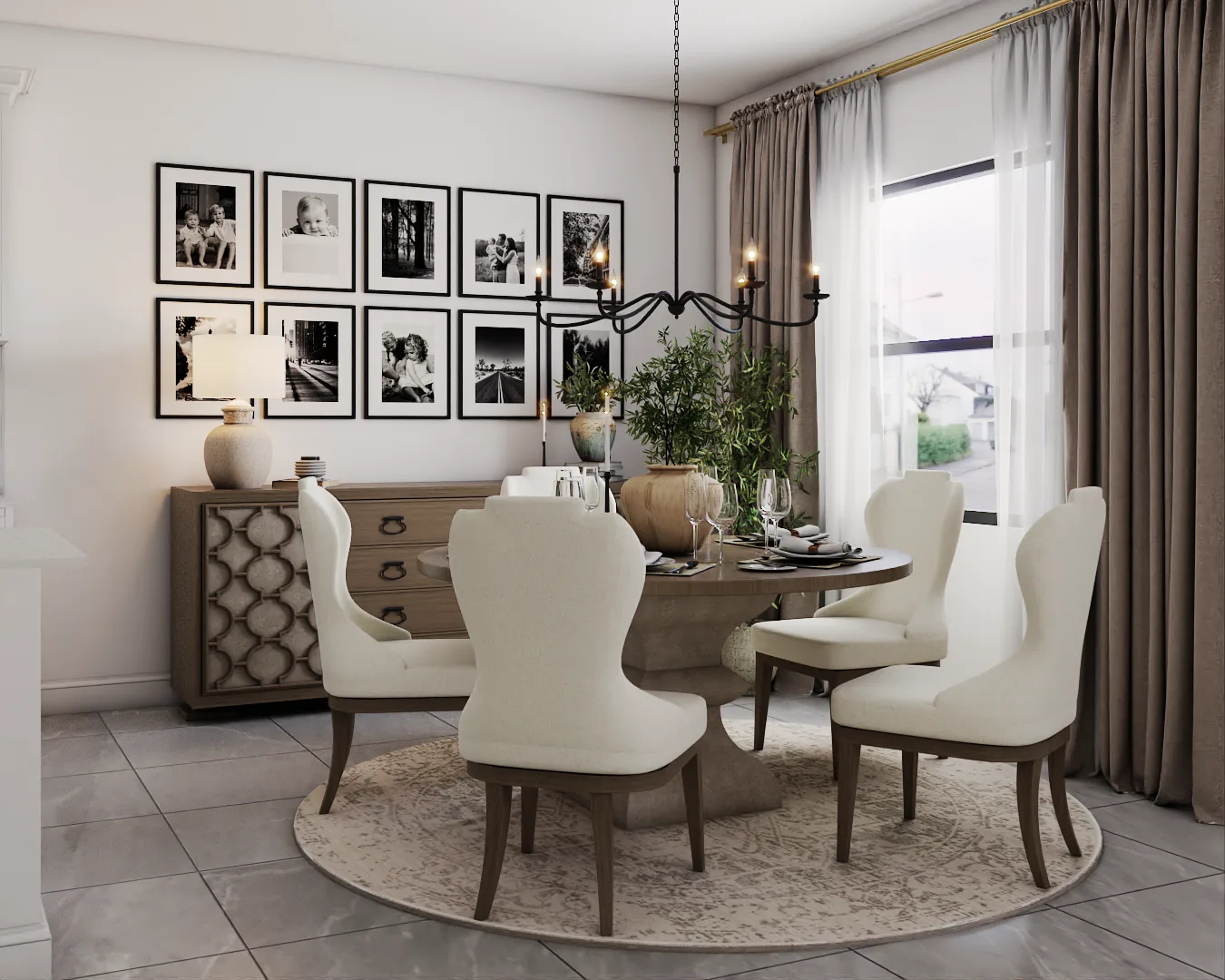 Round walnut pedestal table, cream wingback chairs, iron chandelier, B&W gallery wall in modern farmhouse dining room