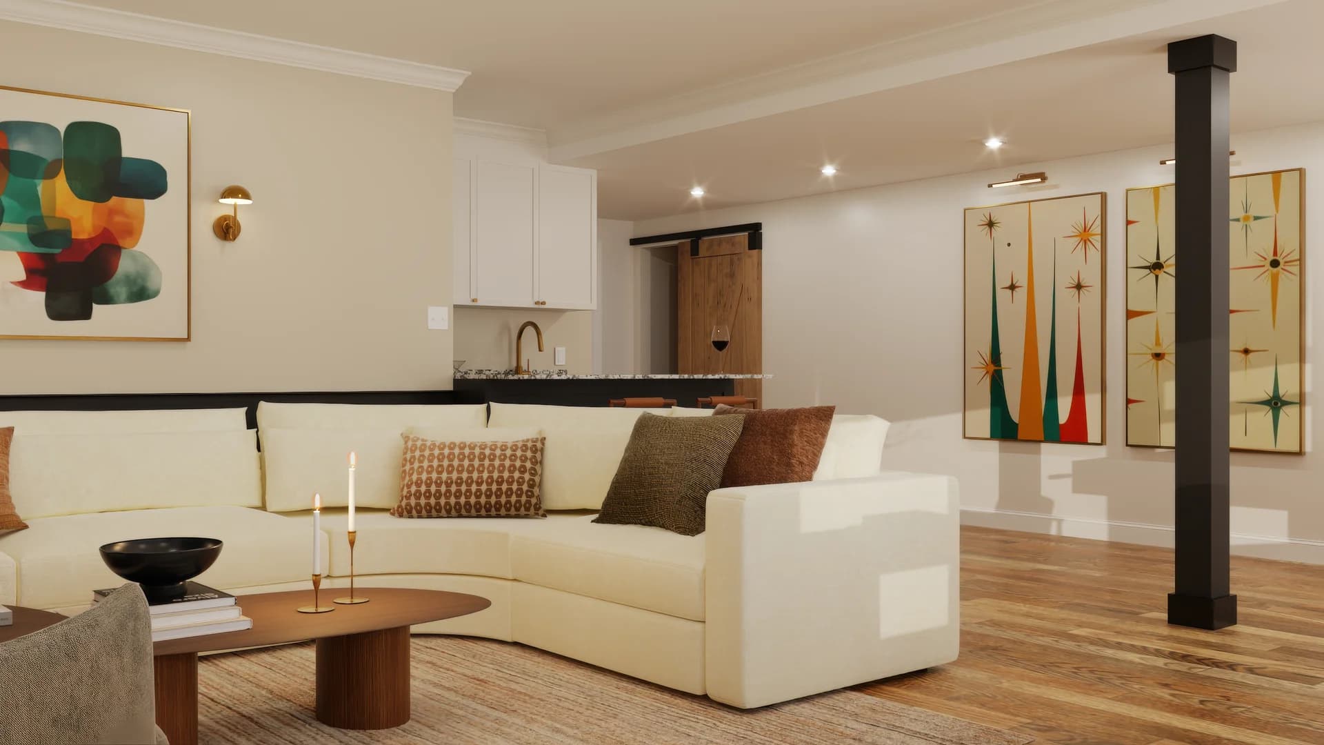 Basement bar area with white upper cabinets, dark granite countertop, brass faucet, barn door in background, black structural column, cream sectional in foreground, and two midcentury starburst panel artworks in teal green and gold on the wall.