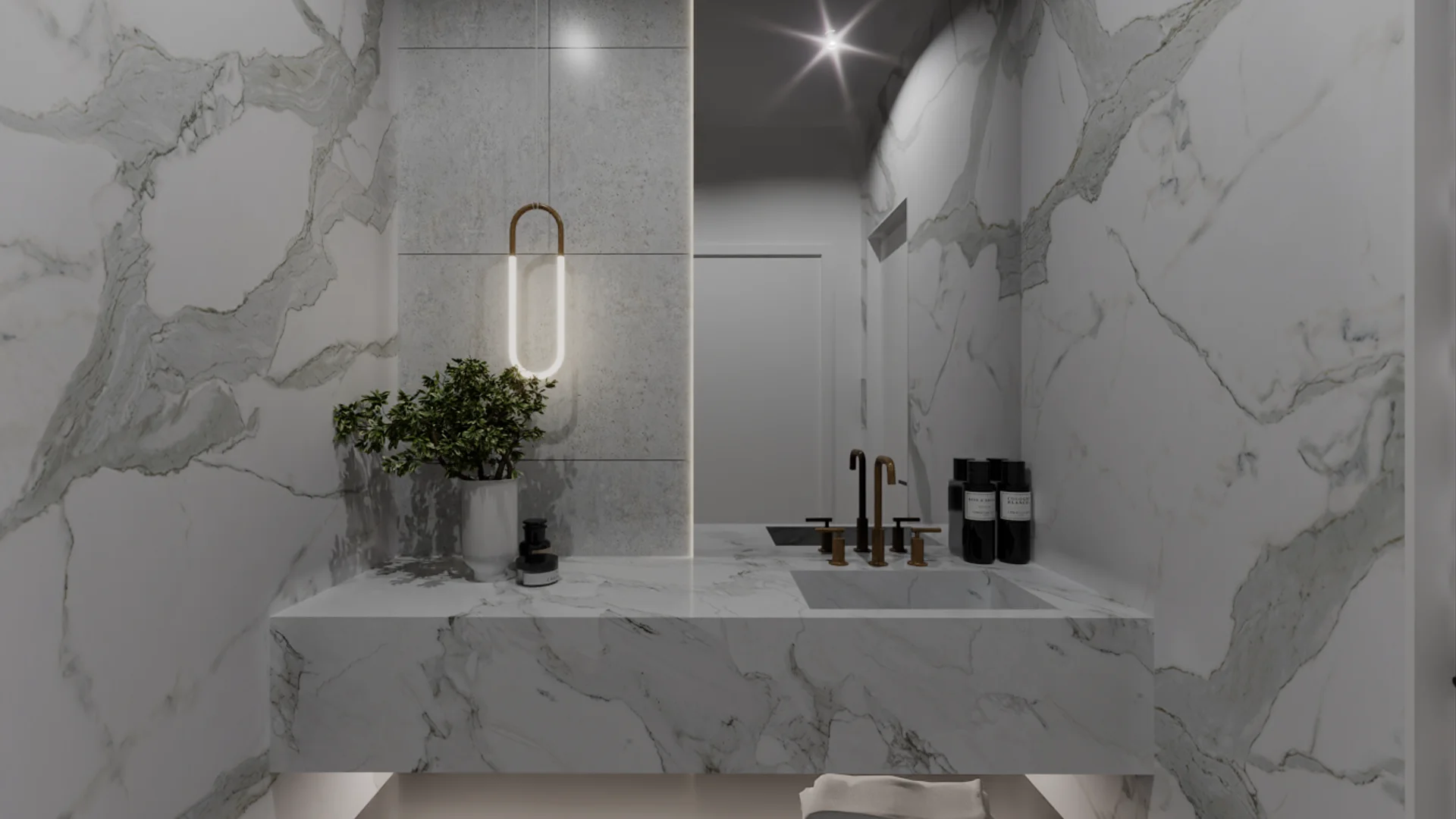 Calacatta marble powder room with floating vanity, brass faucet, and wall sconce