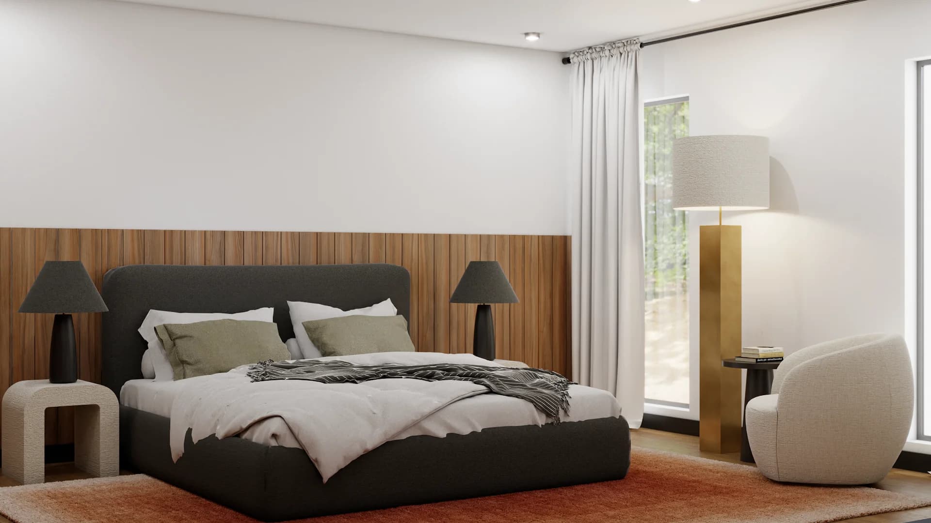 Charcoal bed against walnut headboard panel with sage bedding, terracotta rug, gold floor lamp, and cream armchair by window