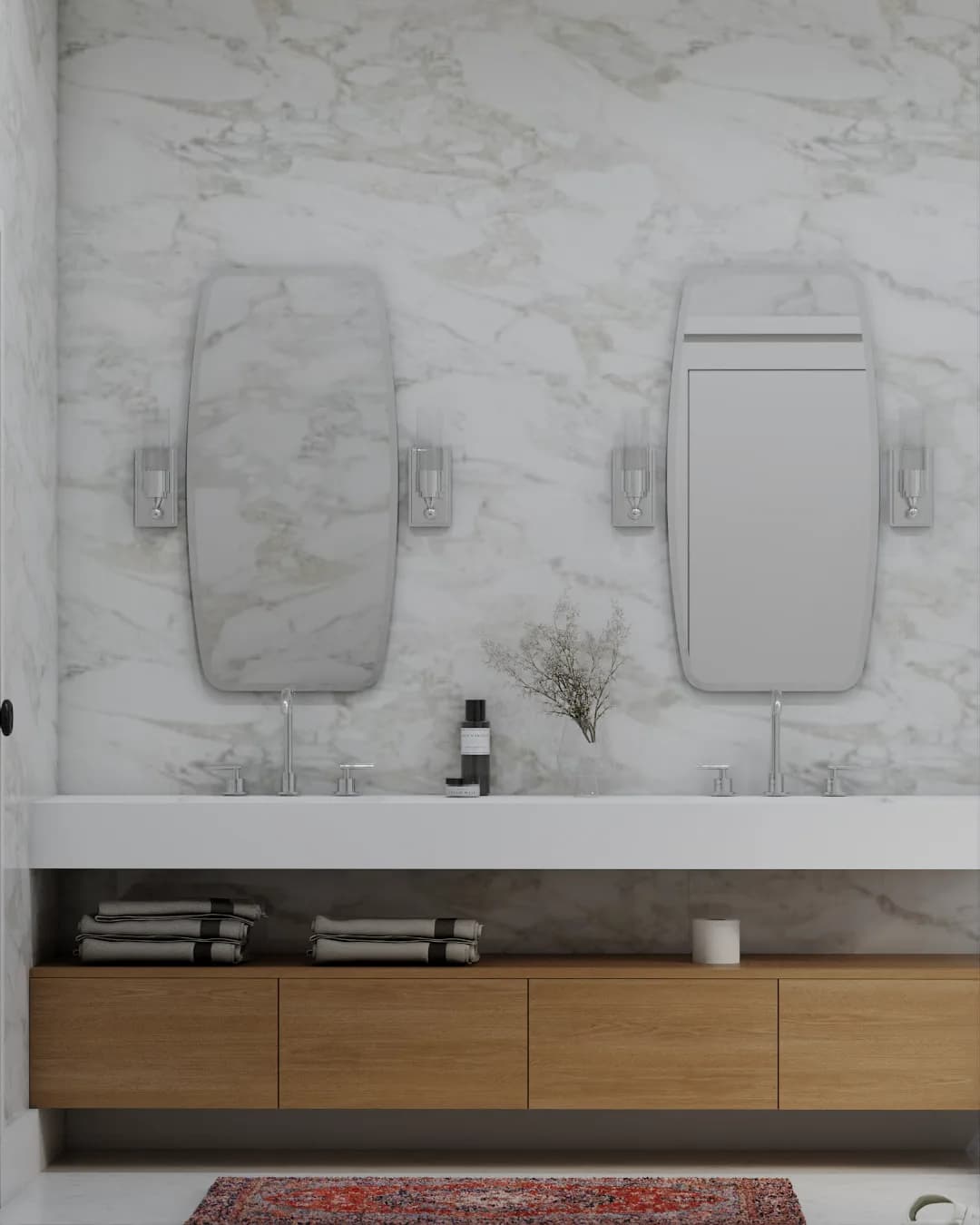 Close-up of floating oak vanity with dual asymmetric mirrors and integrated sink