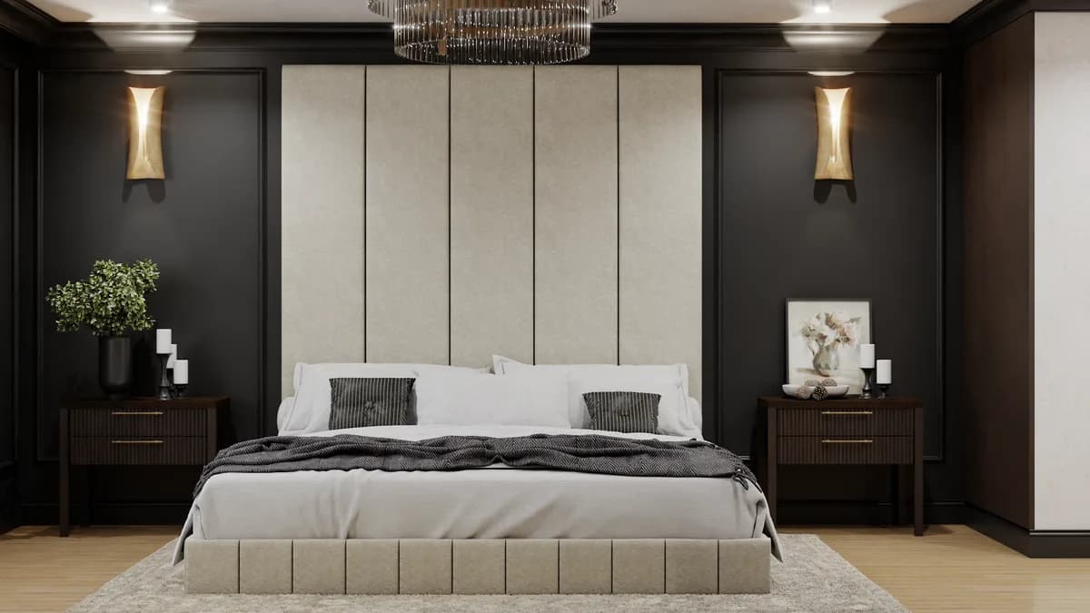 Dark charcoal paneled bedroom with cream channel headboard, gold sconces, walnut nightstands, and brass chandelier in a transitional apartment