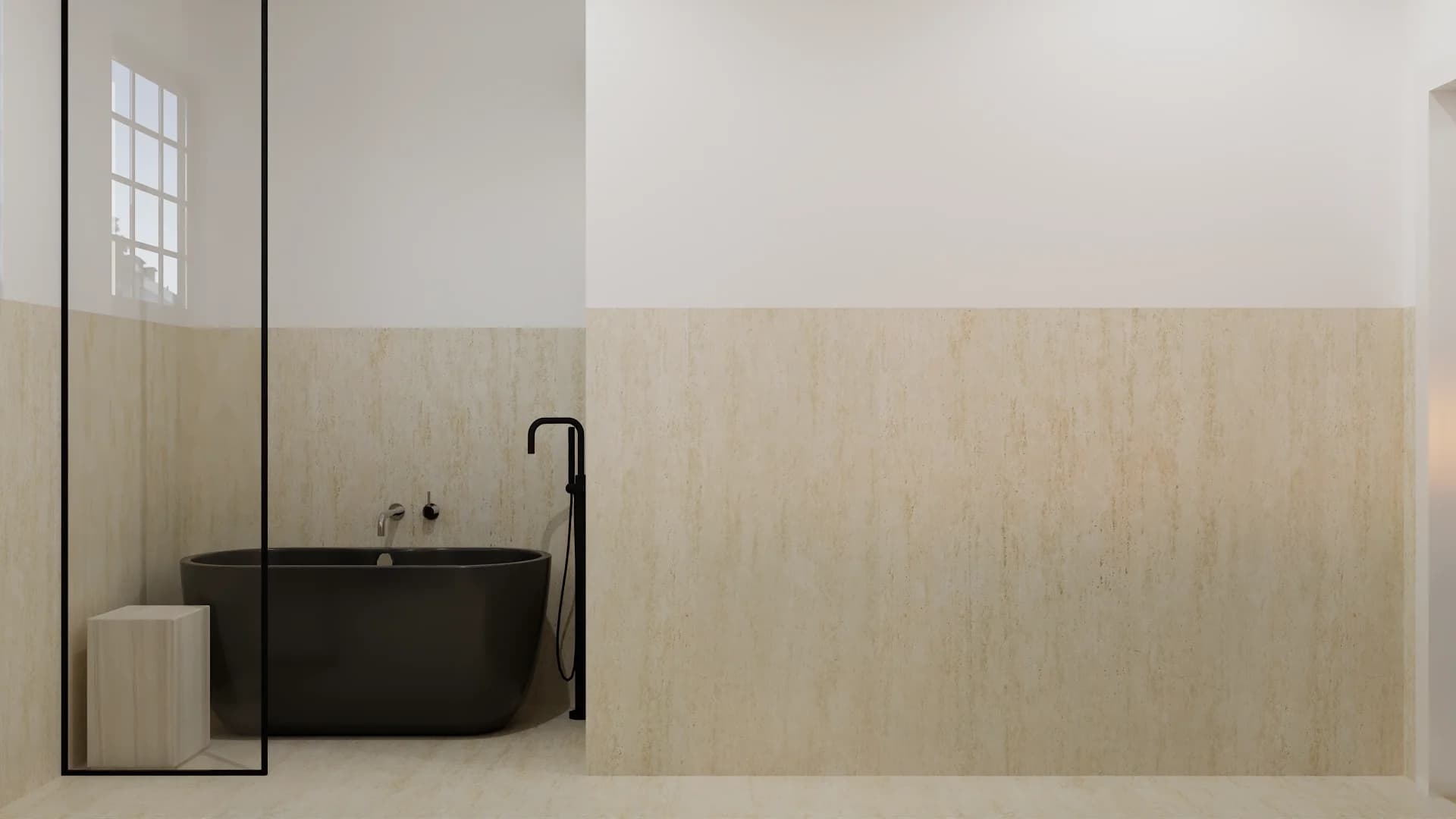 Bathroom with black freestanding oval tub, black freestanding tub filler, and travertine wall