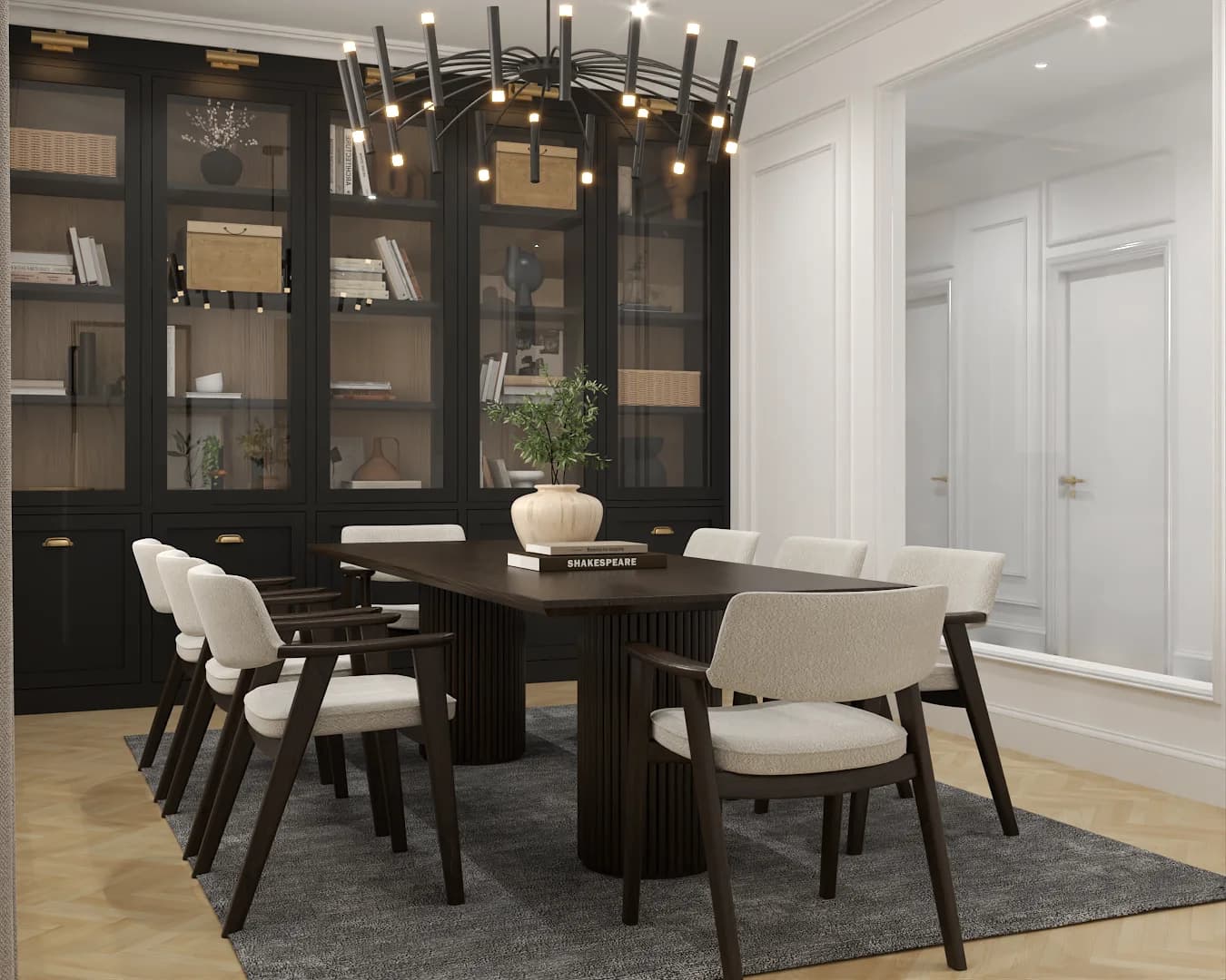 Dining room with ribbed walnut pedestal table and modern wire chandelier above black display cabinets