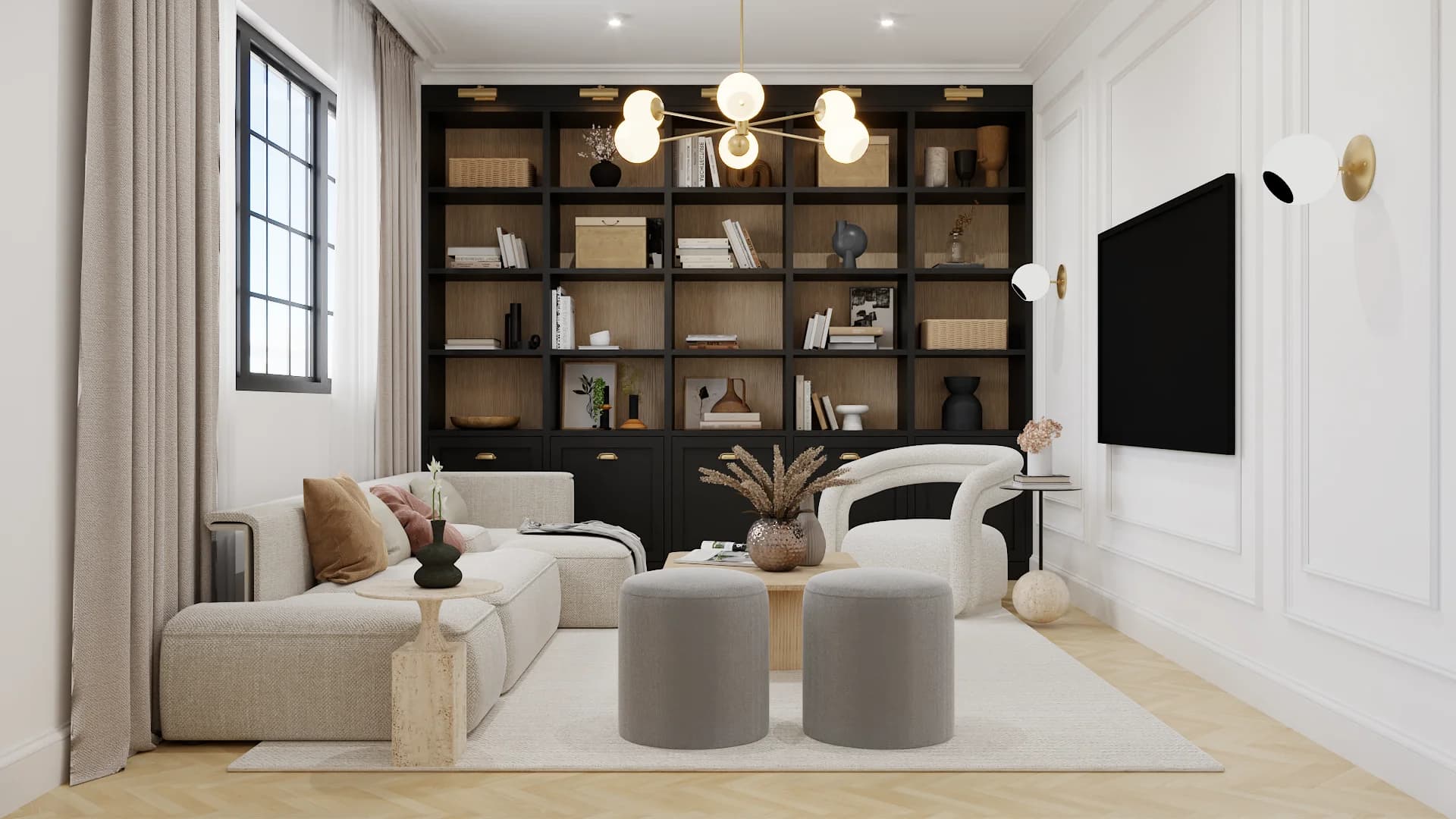 Library with sectional facing black bookcase wall and mounted TV, brass chandelier, and ottomans