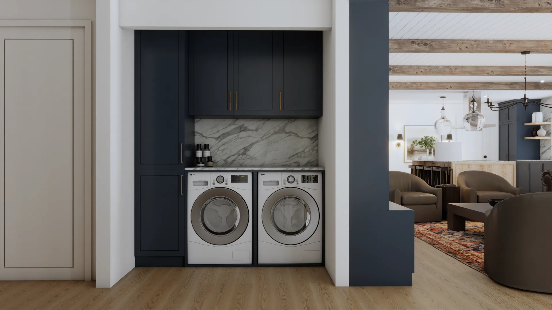 Laundry nook with navy cabinet surround, marble backsplash, and washer dryer