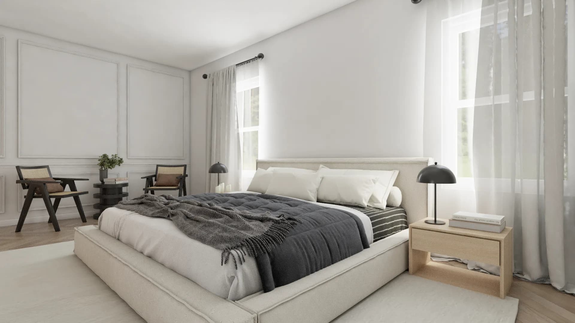 Primary bedroom wide view with cream bed, mushroom lamps, cane chairs, and sheer curtains
