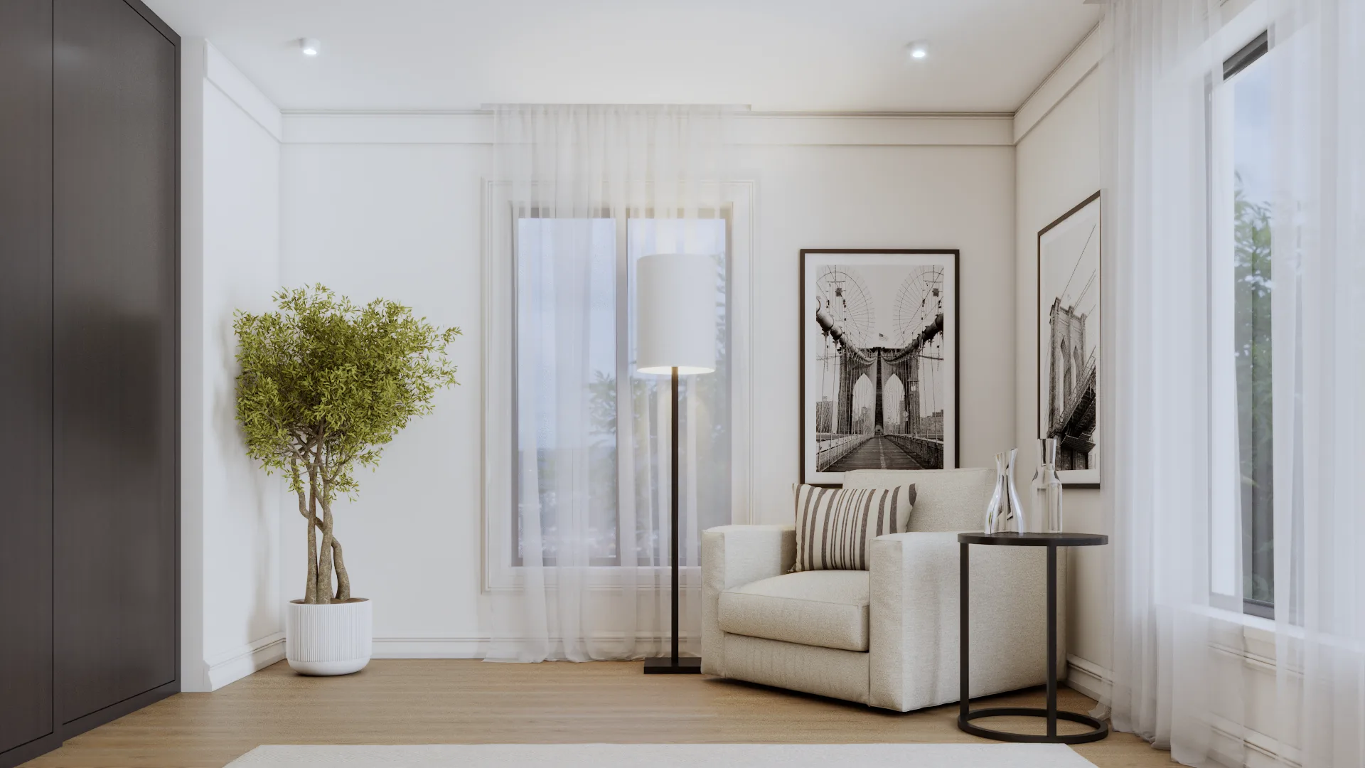 White armchair reading corner with black-and-white bridge photography prints on wall