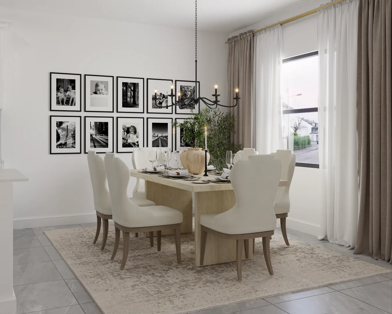 Rectangular table with wingback chairs, iron chandelier, and B&W gallery wall