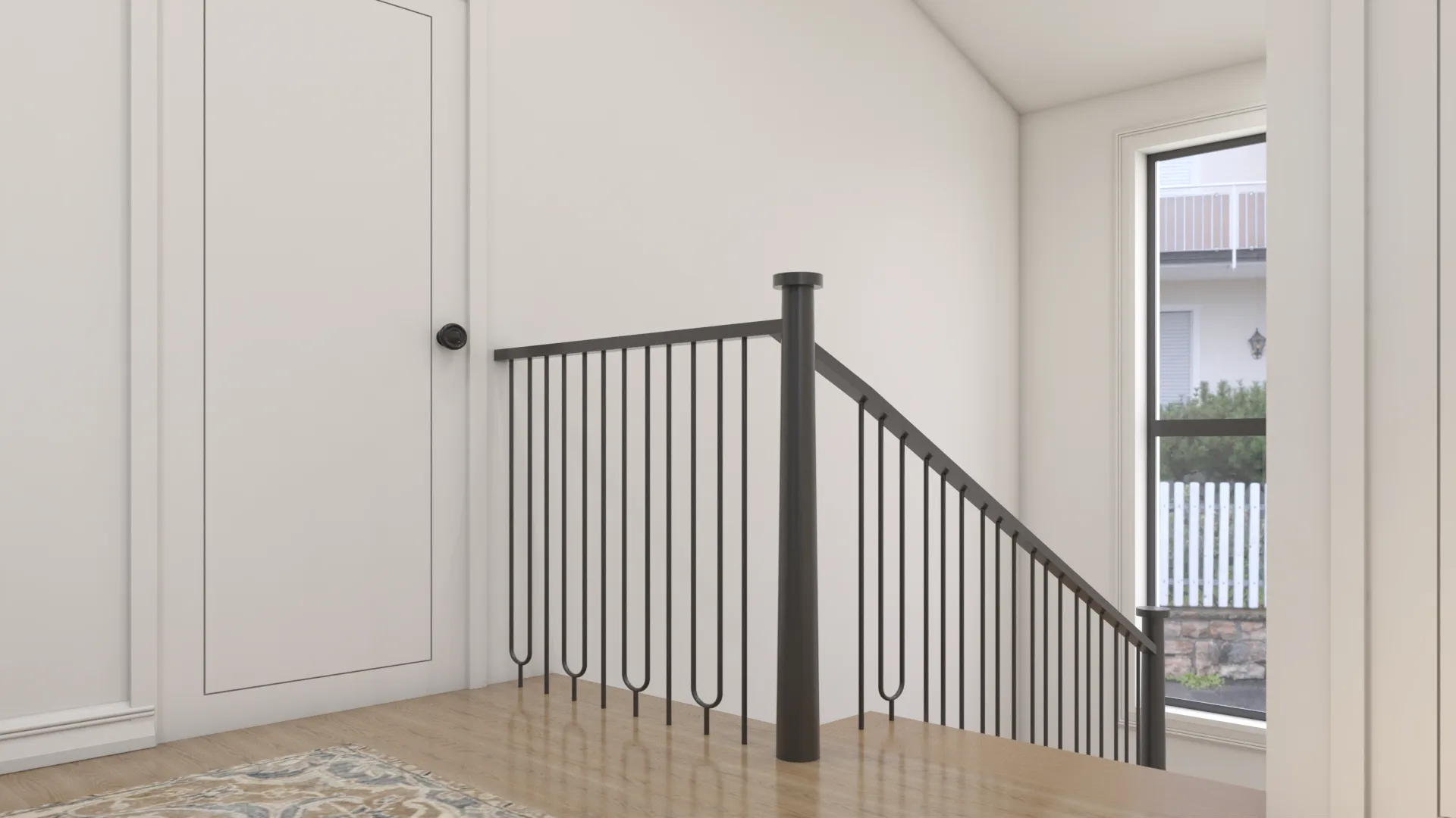 Staircase landing with iron baluster railing, decorative pattern, and oak floor