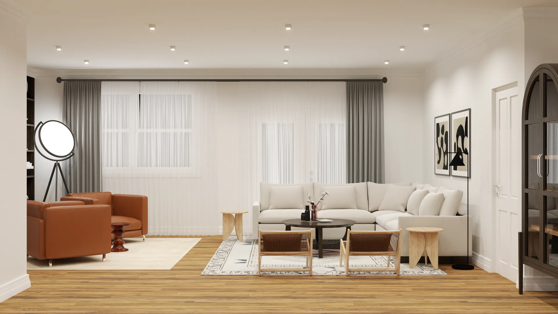 White sectional with caramel club chairs, tripod spotlight lamp, and dark curtains