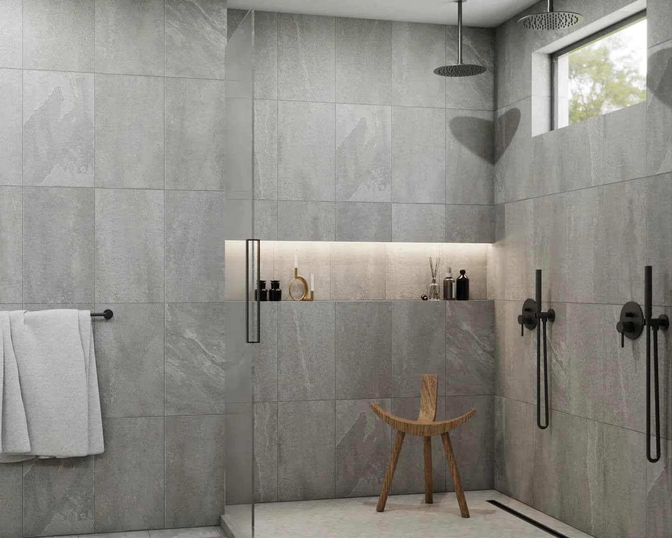 Corner frameless rain shower in gray stone tile bathroom