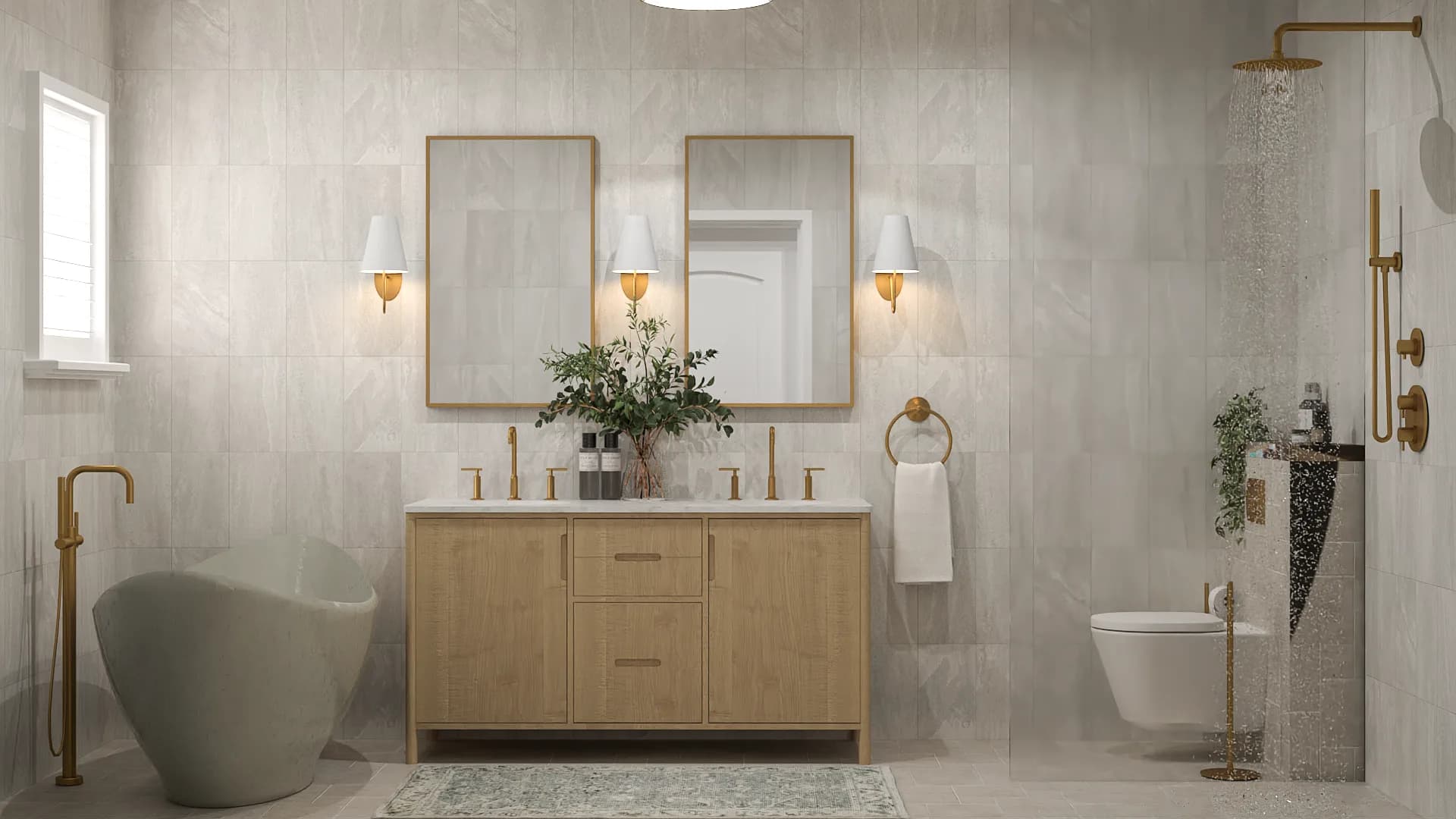 Master bathroom with oak double vanity, sage freestanding tub, brass fixtures, and stone tile