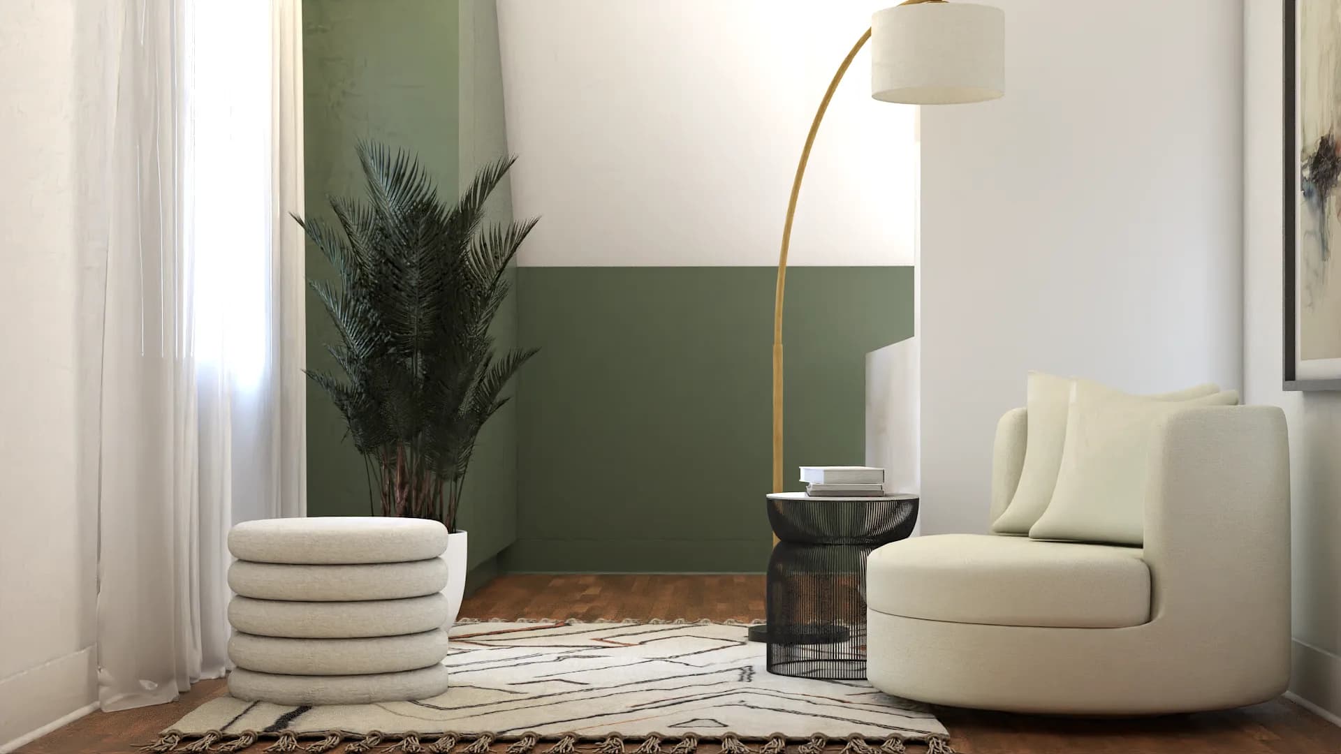 Bedroom sitting area with sage green accent wall, cream armchair, and warm natural light
