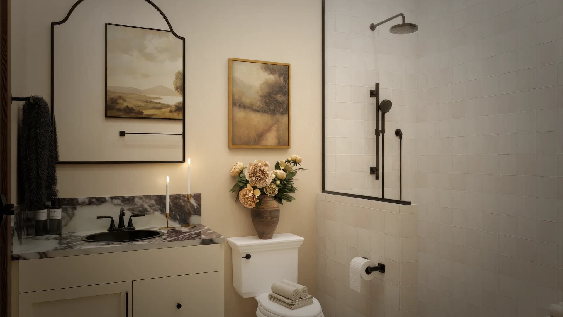 Guest bathroom with arched iron mirror, cream vanity with calacatta marble, black widespread faucet, glass shower enclosure with rain head, dried flowers in terracotta vase, and mosaic floor