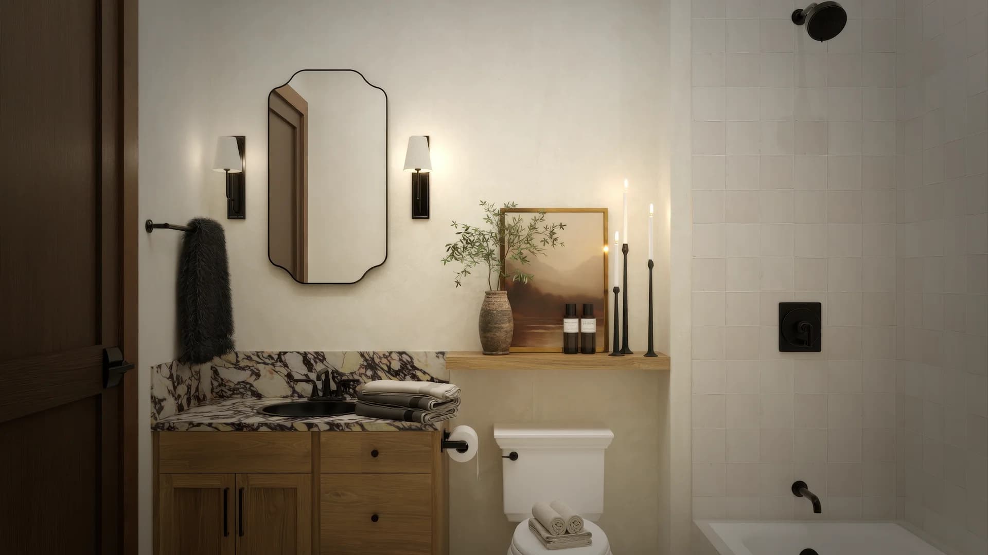 Guest bathroom with octagonal mirror, black wall sconces, oak vanity with calacatta marble top, botanical shelf with greenery, tub shower combo with black fixtures, and landscape art