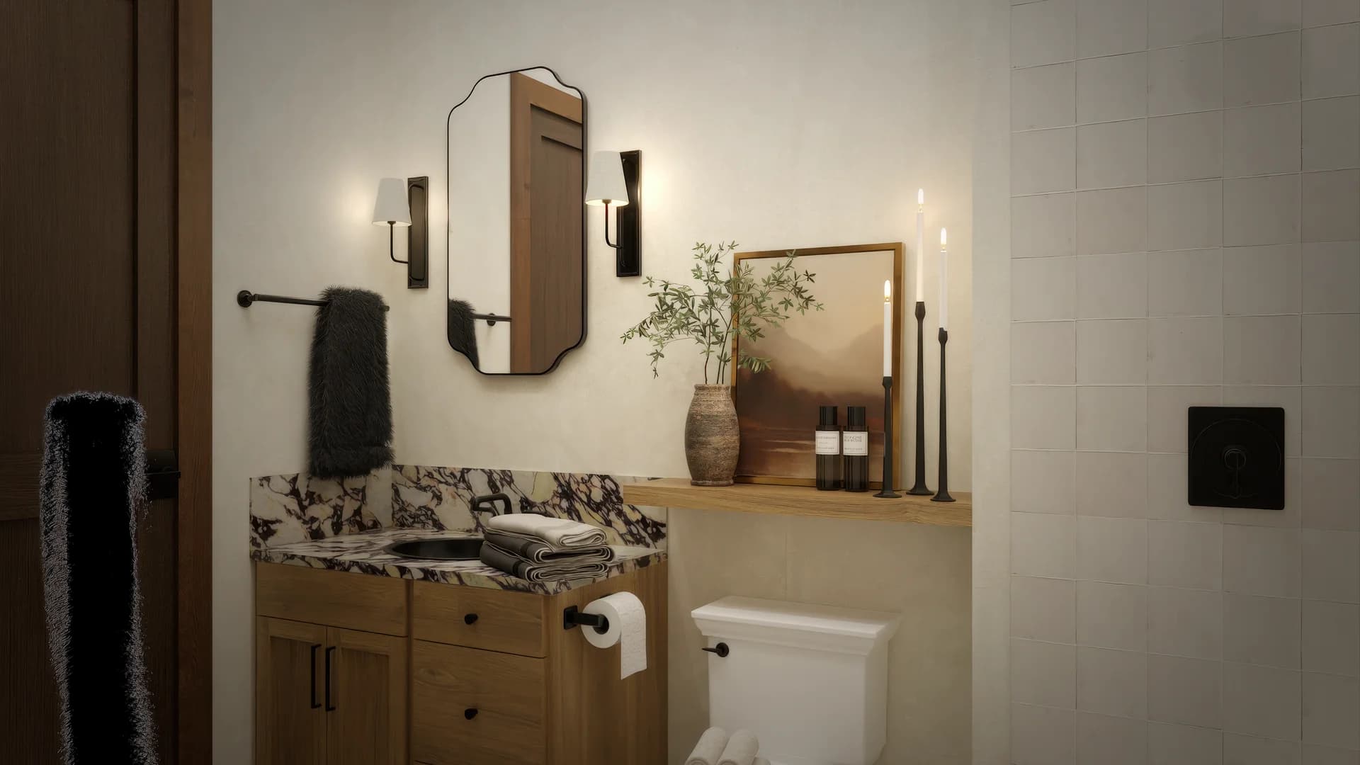 Guest bathroom alternate angle with oak vanity, calacatta marble countertop, black sconces flanking octagonal mirror, bathtub with shower, floating shelf with pottery, and diamond tile floor