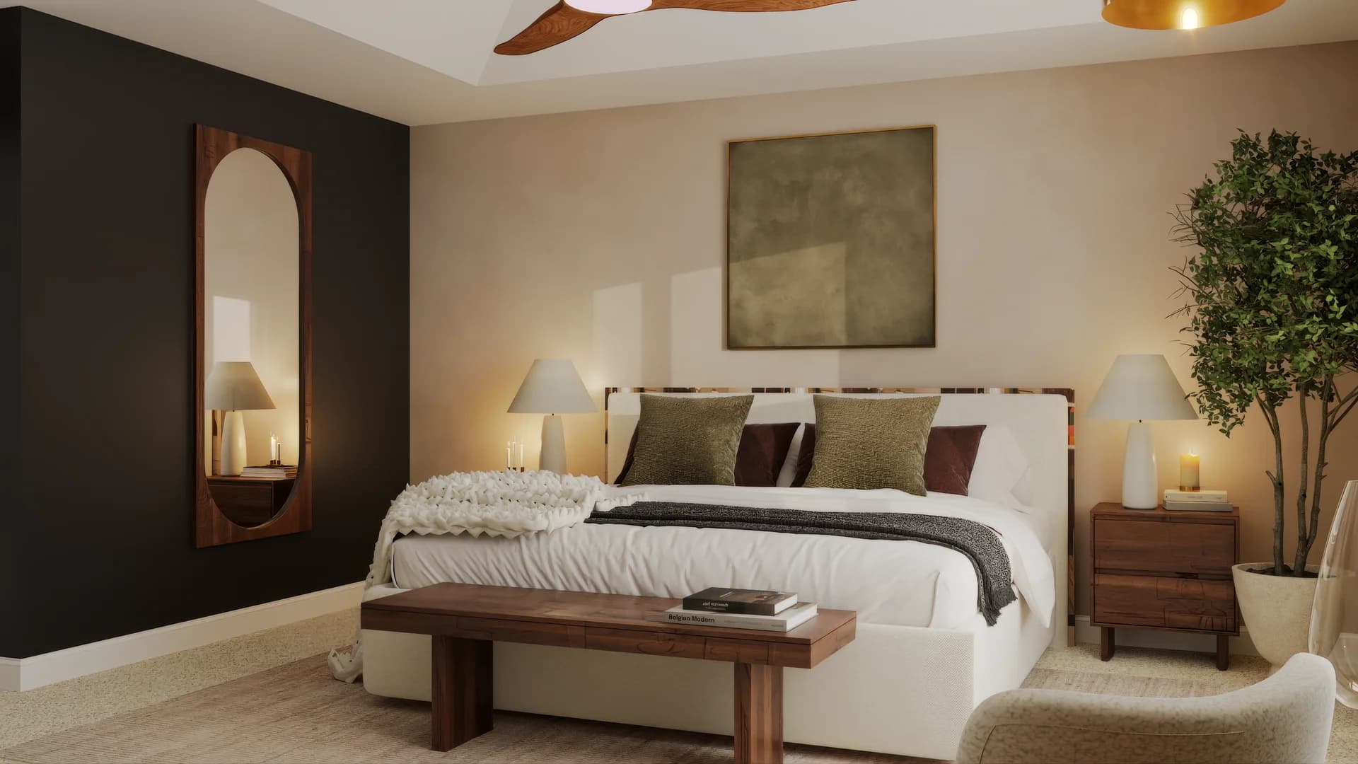 Master bedroom with dark charcoal accent wall featuring tall arched walnut-framed mirror, cream upholstered bed with olive and brown pillows, chunky knit throw, walnut nightstands with lamps, wood ceiling fan, abstract wall art, and potted tree in corner.