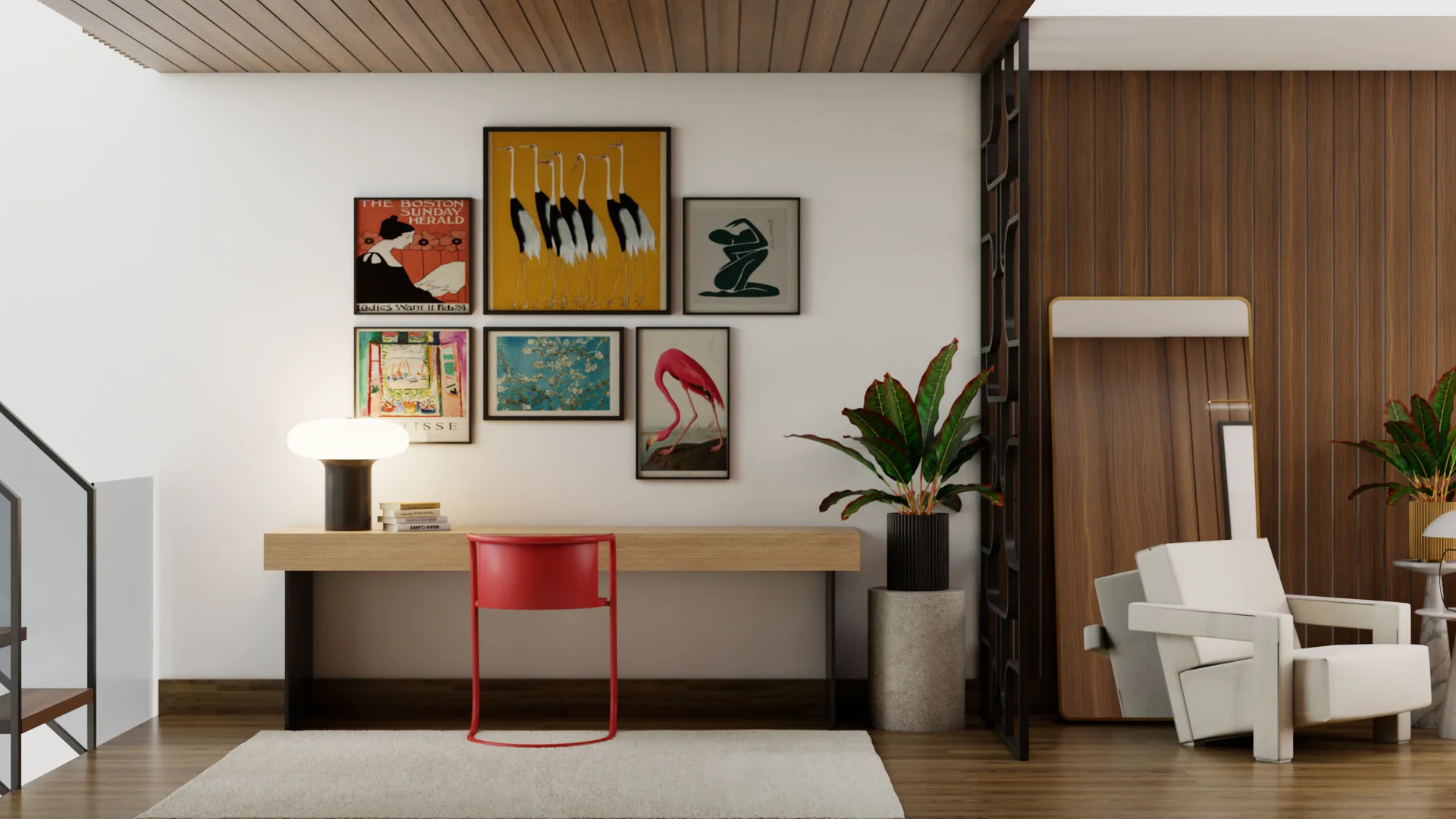 Mid-century modern home office nook with light oak floating desk, red accent chair, slat wood ceiling, five-piece gallery wall featuring flamingo and crane prints, black planter with tropical plant, and white armchair