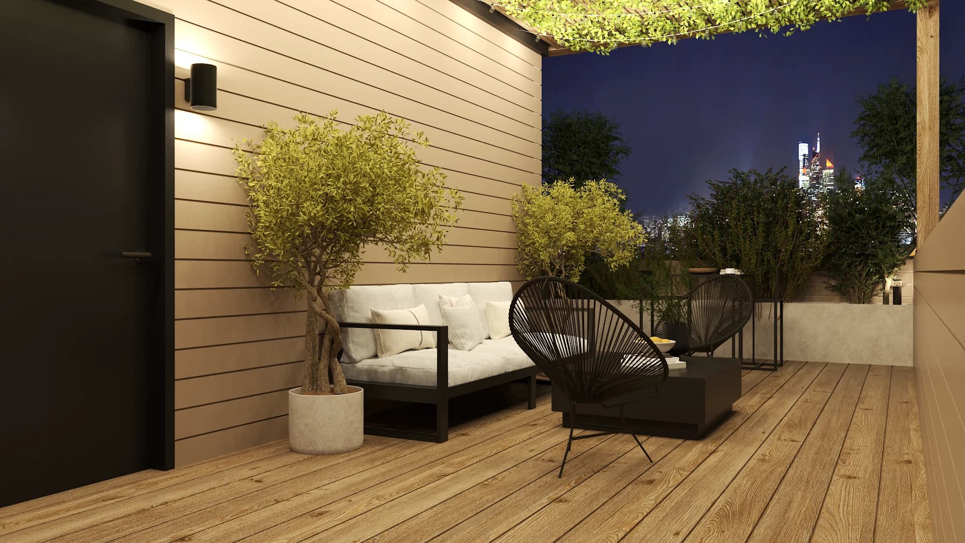 Rooftop terrace at dusk with cream cushioned sofa, Acapulco chair, planters, and night skyline