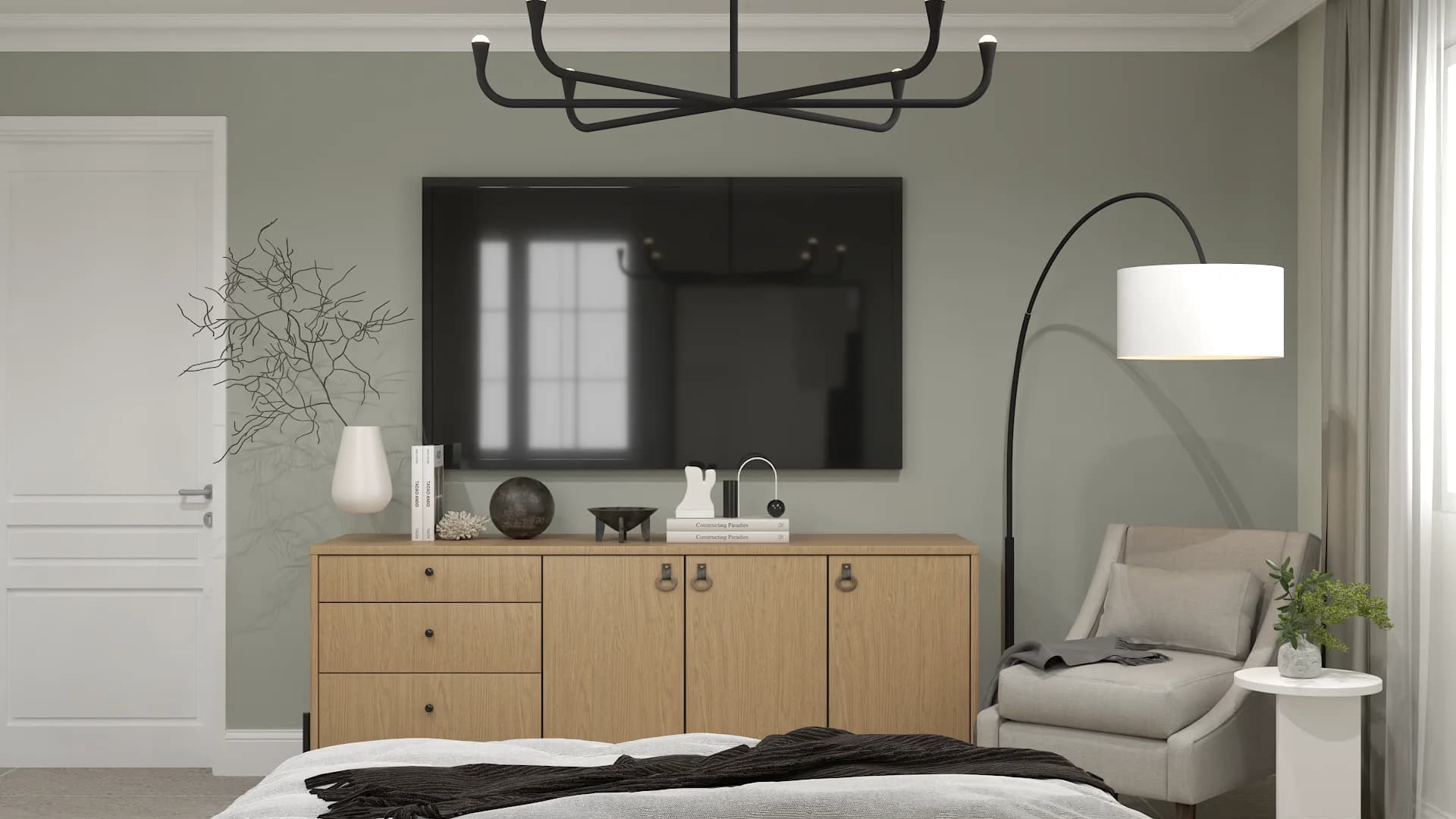 Bedroom with sage green walls, wood dresser, wall-mounted TV, and black arc floor lamp