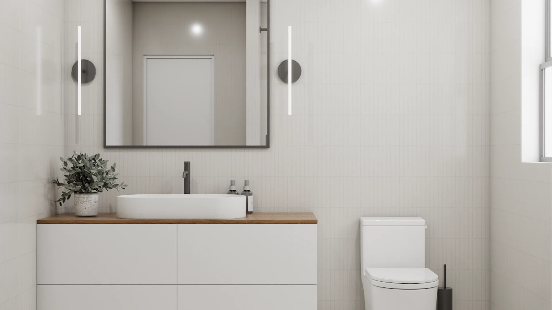 Floating vanity with oak countertop, vessel sink, black faucet, white subway tile, charcoal-framed mirror, and wall sconces