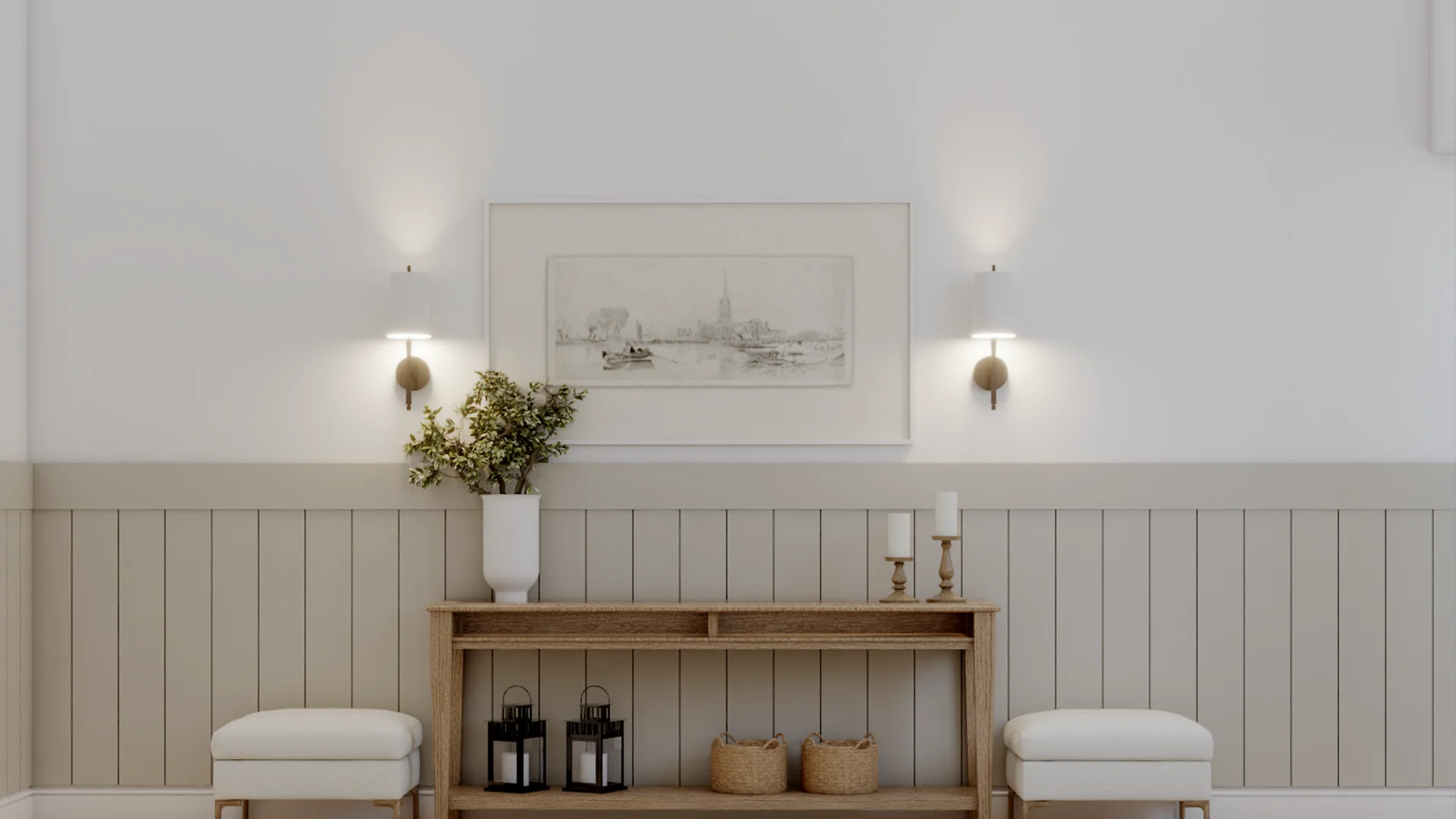 Foyer with oak console holding black lanterns and wicker baskets, two white square ottomans flanking it, greige shiplap wainscoting, brass ball sconces, and framed landscape above, by Debora Interiors
