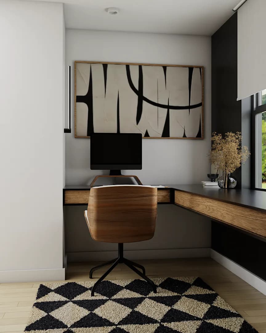 Single monitor in white wall alcove with abstract art above and walnut chair