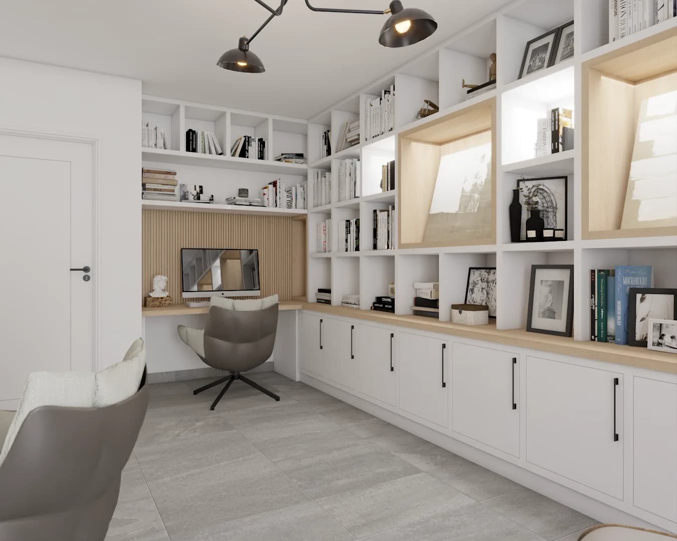 White floor-to-ceiling cabinetry with black pulls, oak desk, and illuminated display shelves