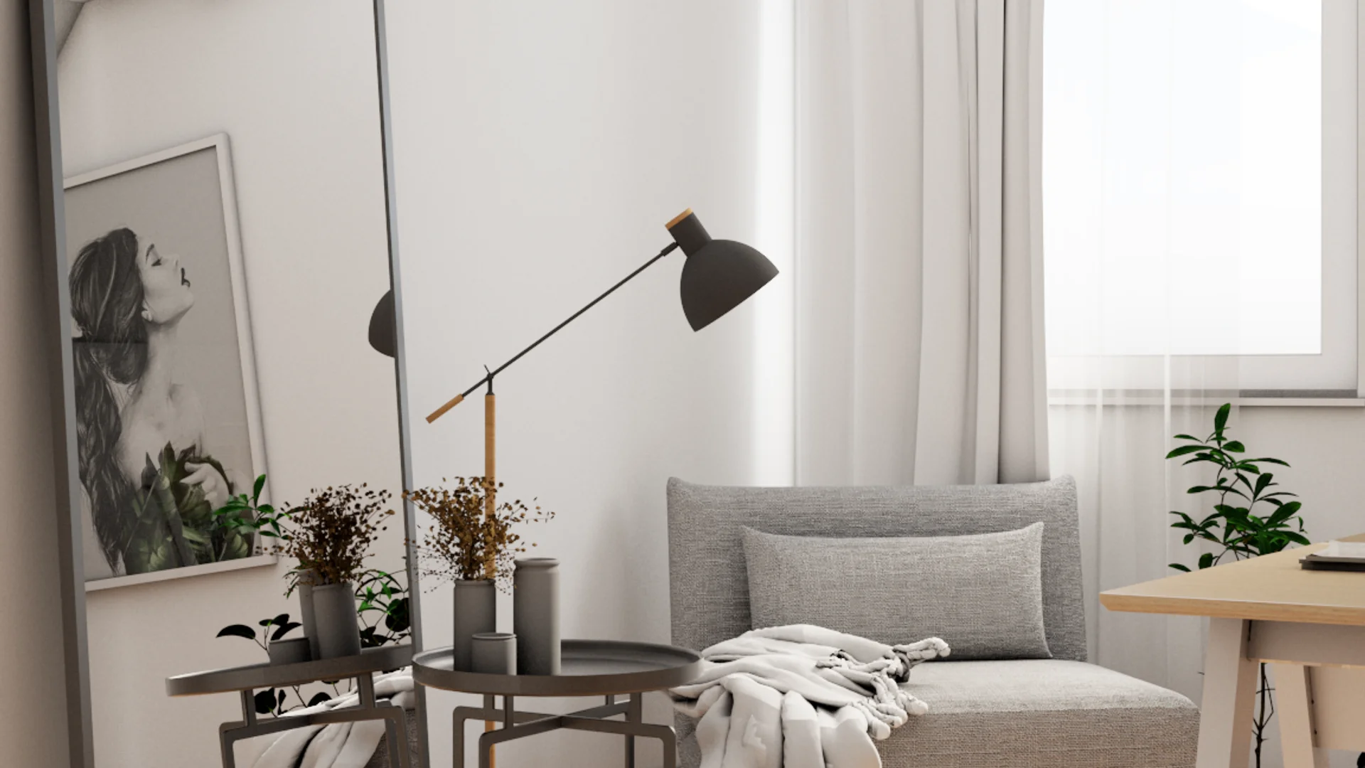 Lounge corner with floor mirror, gray loveseat, black nesting tables, and potted plants