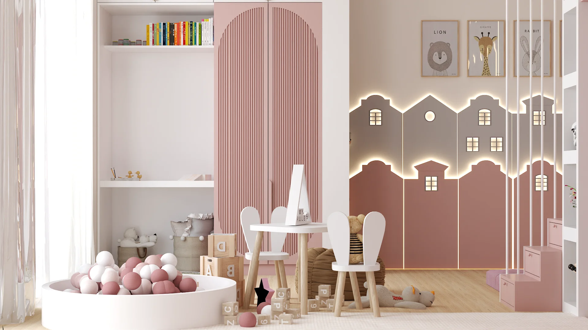 Ball pit play area with bunny-ear chairs and townhouse LED wall panel with backlit windows