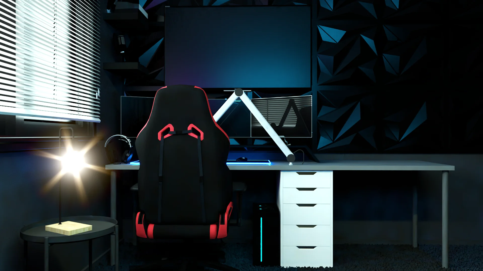 Gaming desk close-up with red and black chair, monitor, and white drawer unit