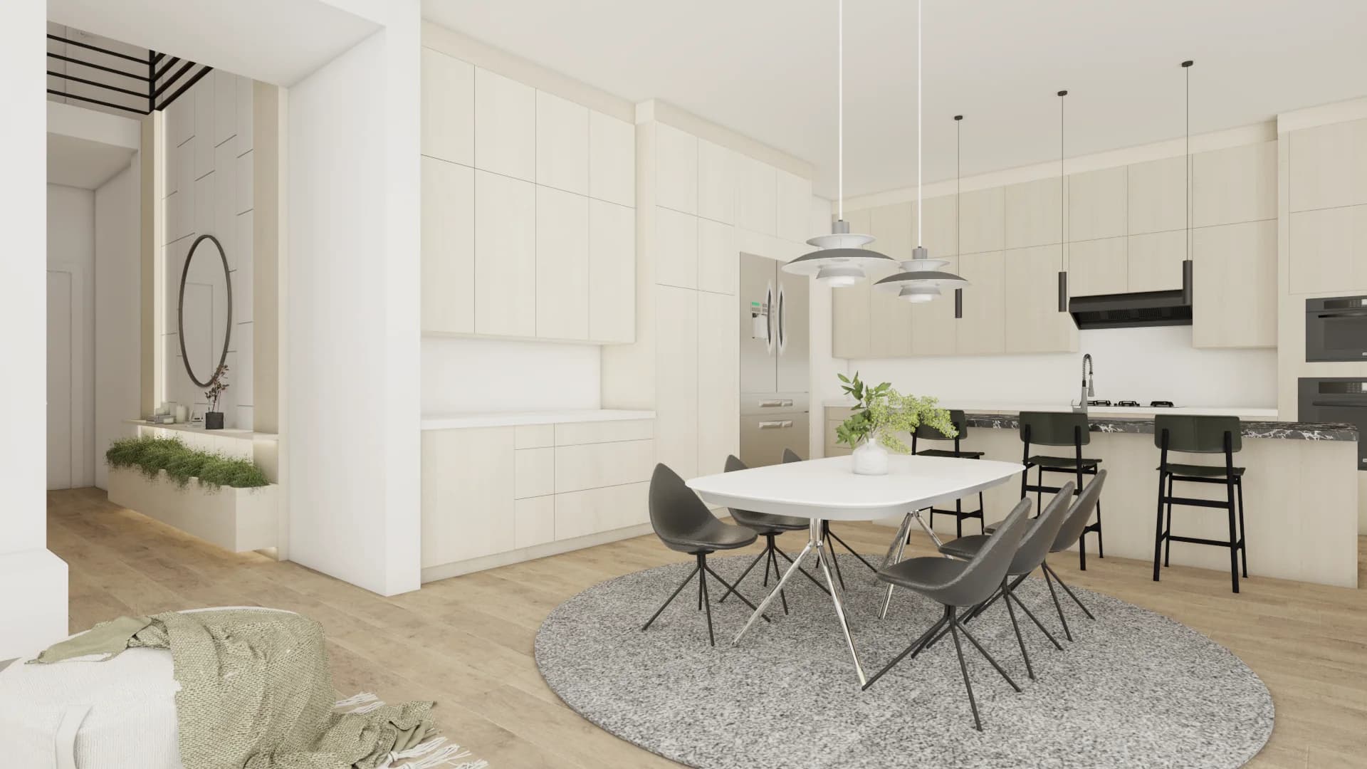 Open plan kitchen with white flat-front cabinets, oak floors, round dining table, dark pendant lights