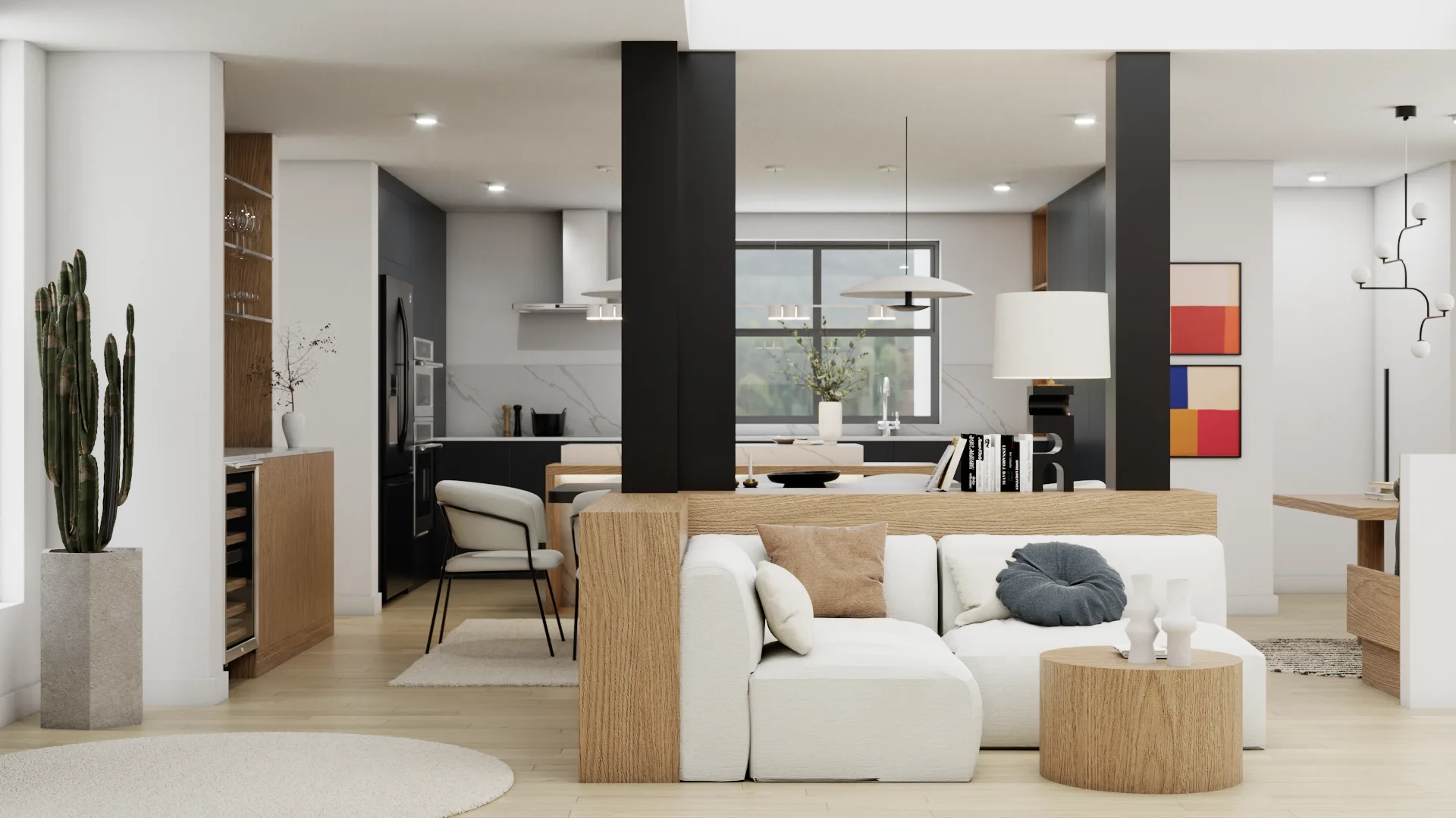Open-plan living and kitchen with dark cabinetry, white sofa between black columns, and art
