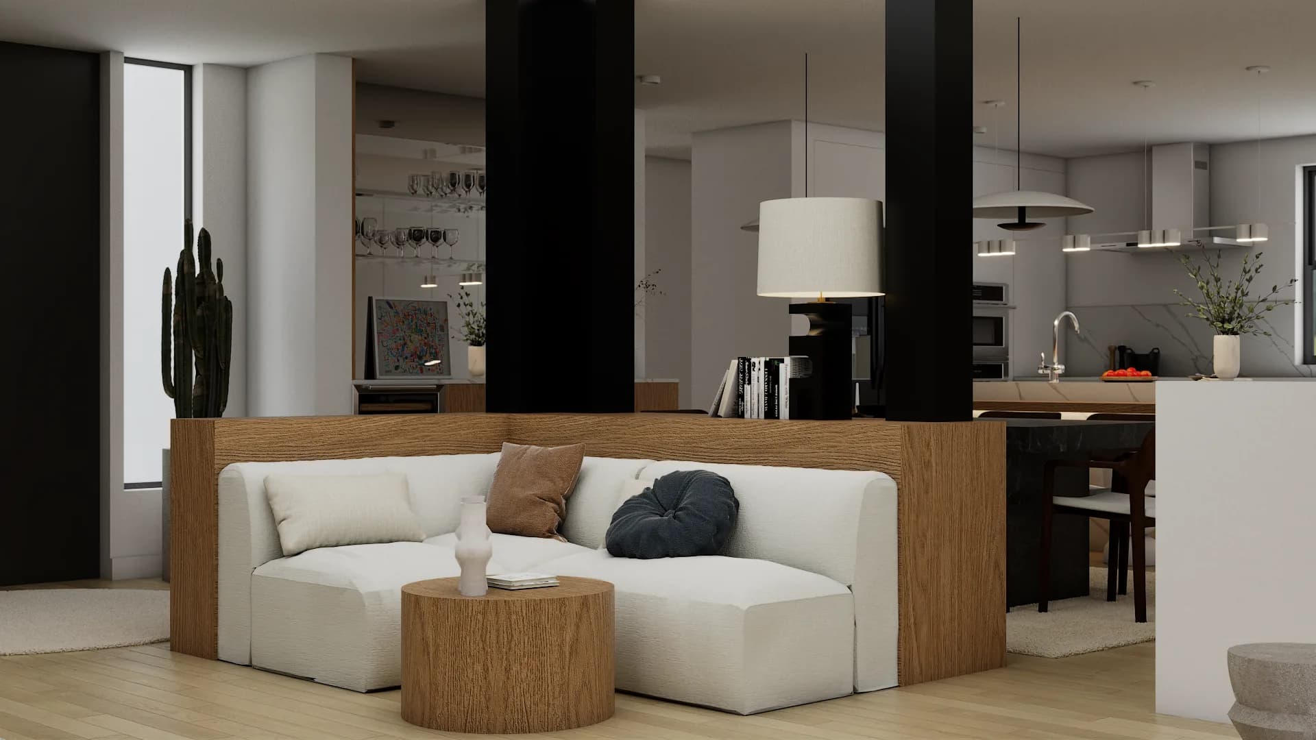 Front view of white sofa with oak base surround and twin black columns framing kitchen