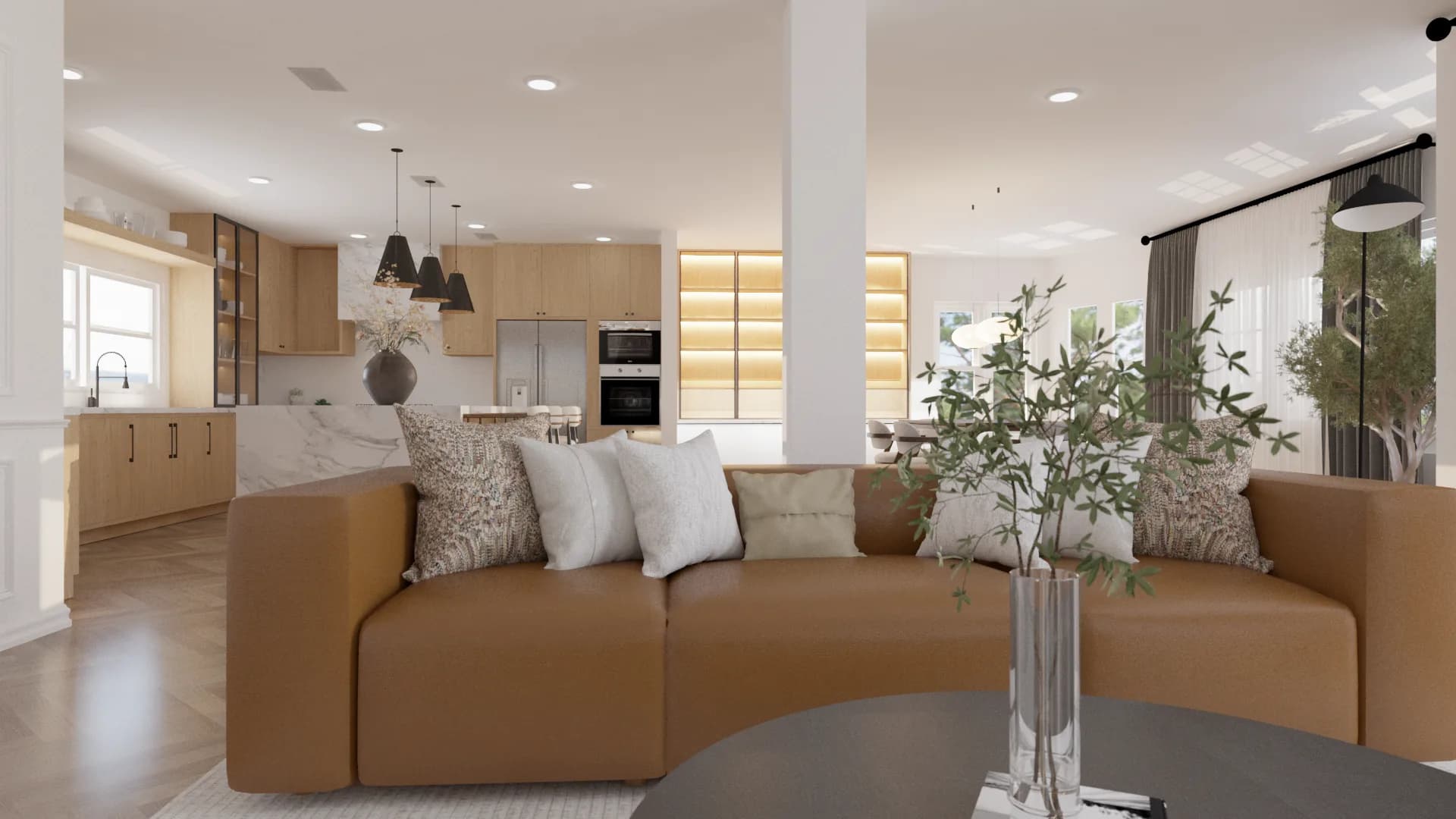 Open plan living room with curved caramel leather sofa, travertine coffee table, abstract art, and light oak kitchen in background