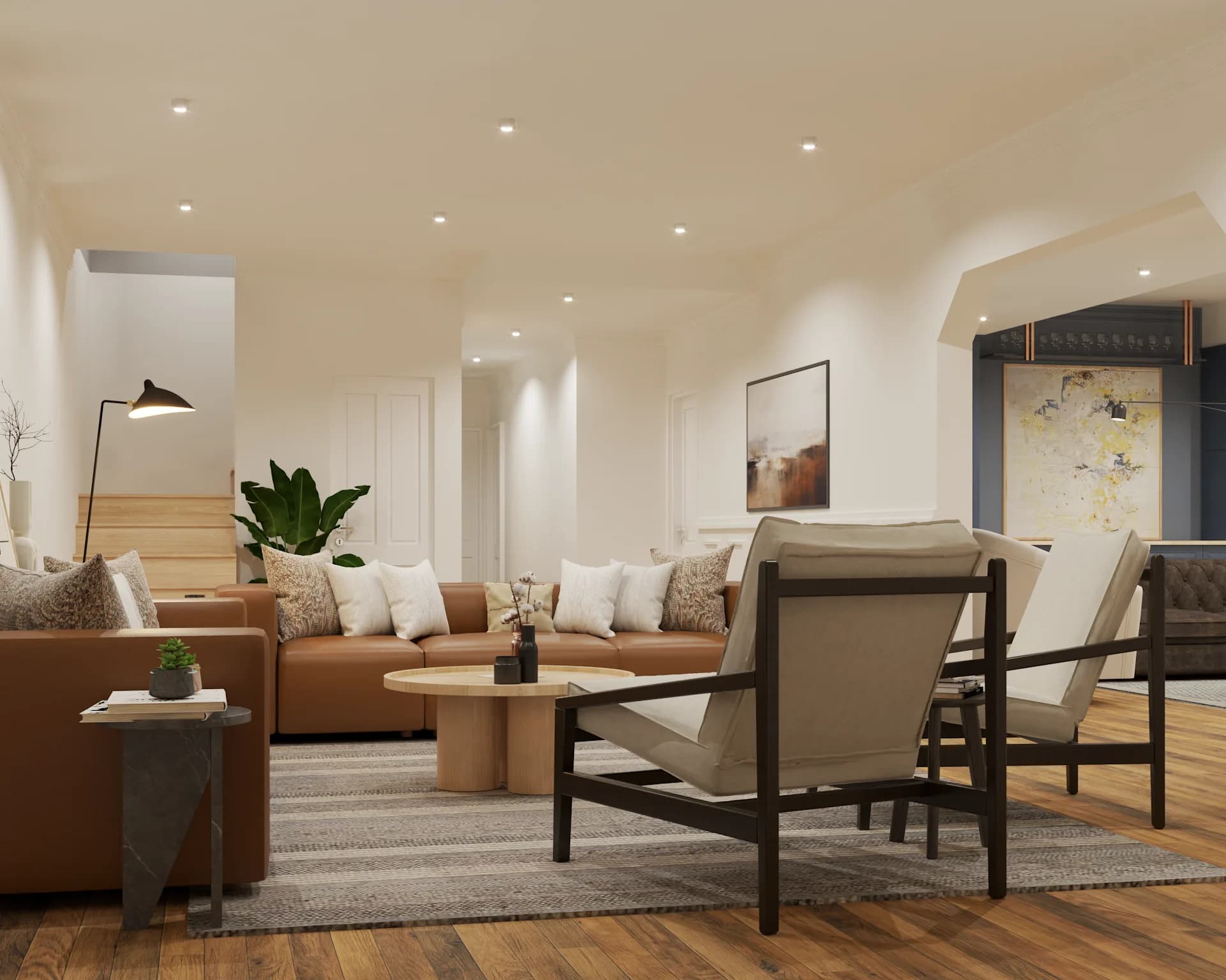 Wide angle of full open plan with leather sofa, kitchen, and arched doorways