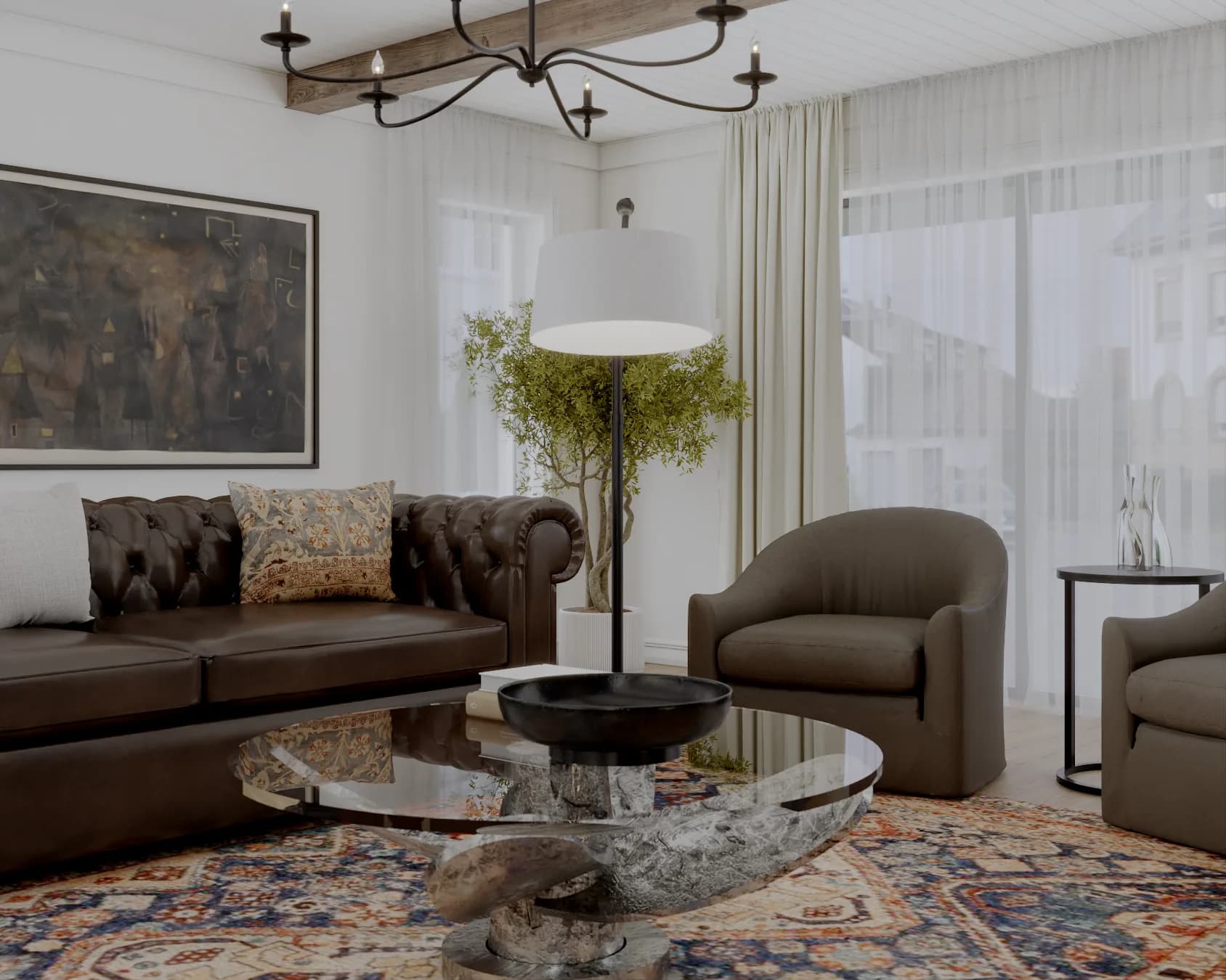 Close view of Chesterfield sofa, glass coffee table, and rounded club chairs with sheer curtain backdrop