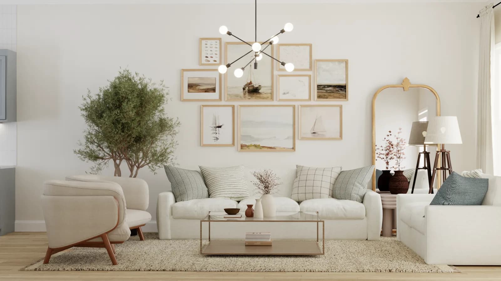 Coastal living room with cream sofa, nine-frame sailboat gallery wall, sputnik chandelier, and indoor olive tree on jute rug