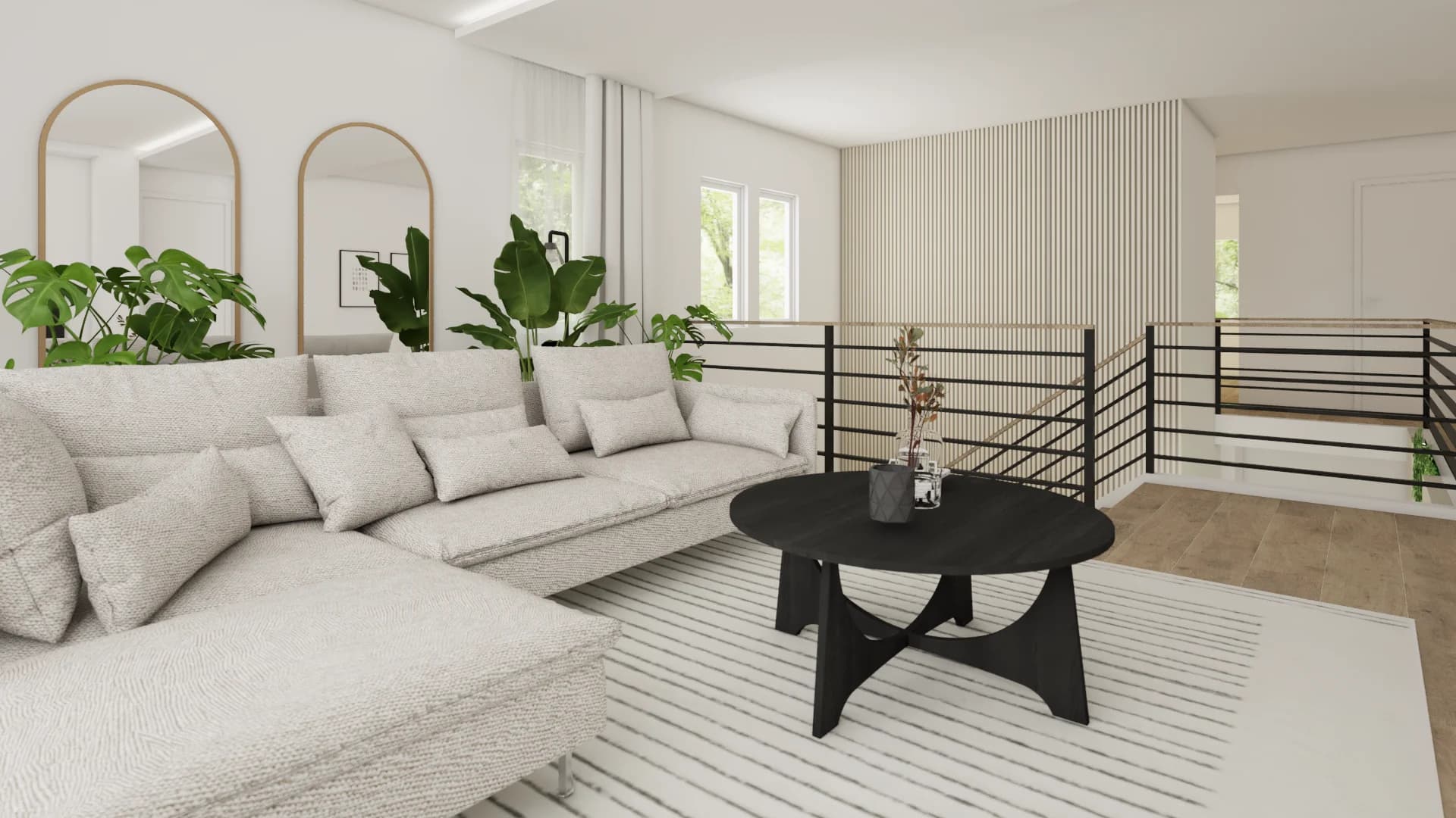 Loft level with gray sectional, twin arch mirrors, black round coffee table, and monstera plants