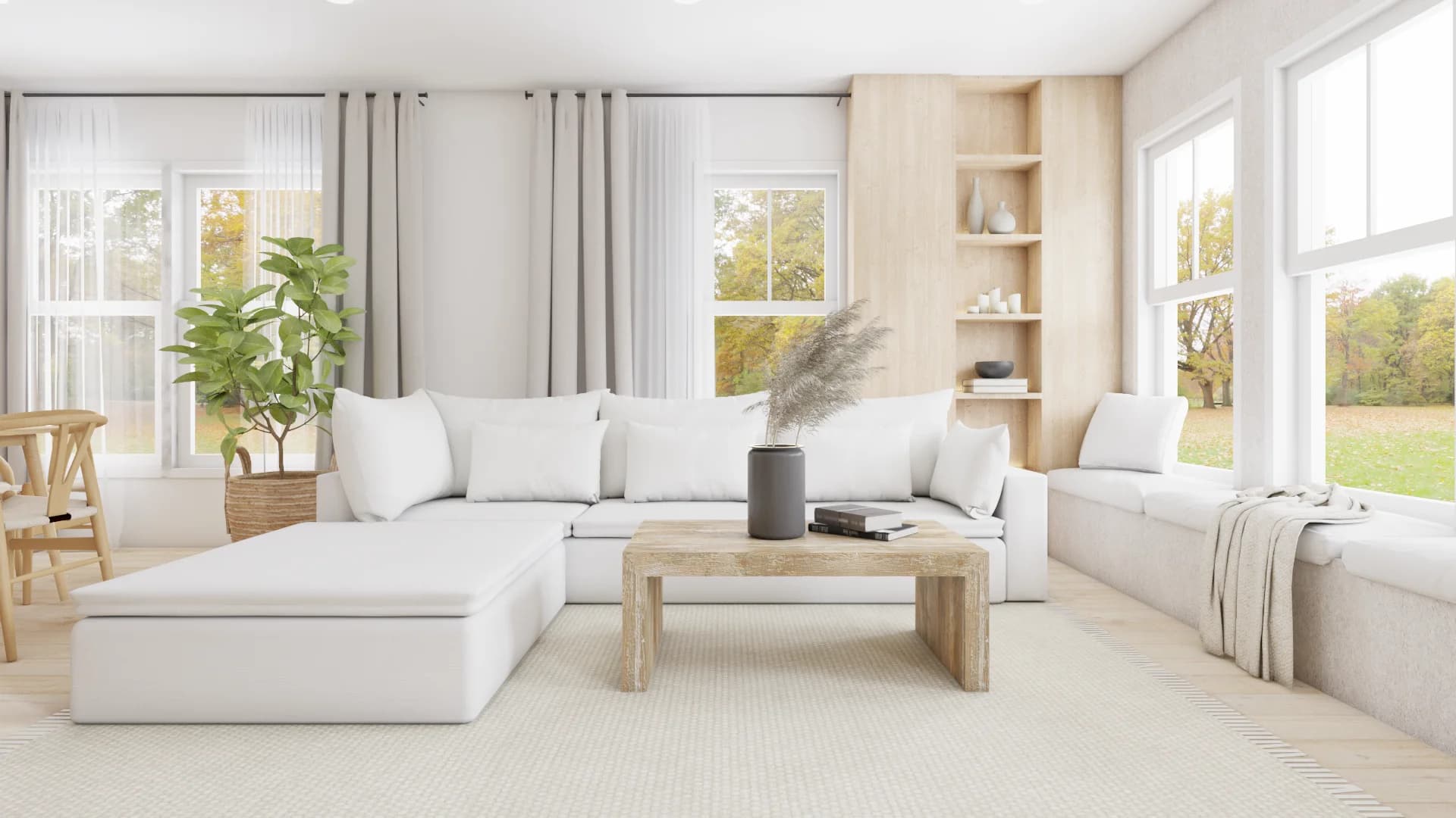 White sectional with oak travertine coffee table, pampas grass vase, window bench, and autumn yard view